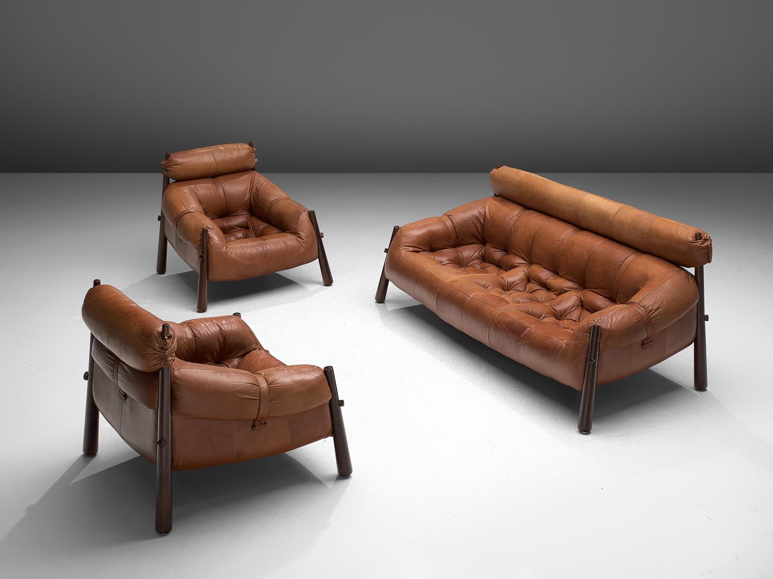 Percival Lafer, living room set model MP-81, in rosewood and leather, Brazil, 1972.

Beautiful set of one sofa, two lounge chairs and an ottoman by Brazilian designer Percival Lafer. Every piece consist of a solid dark wooden base to which the