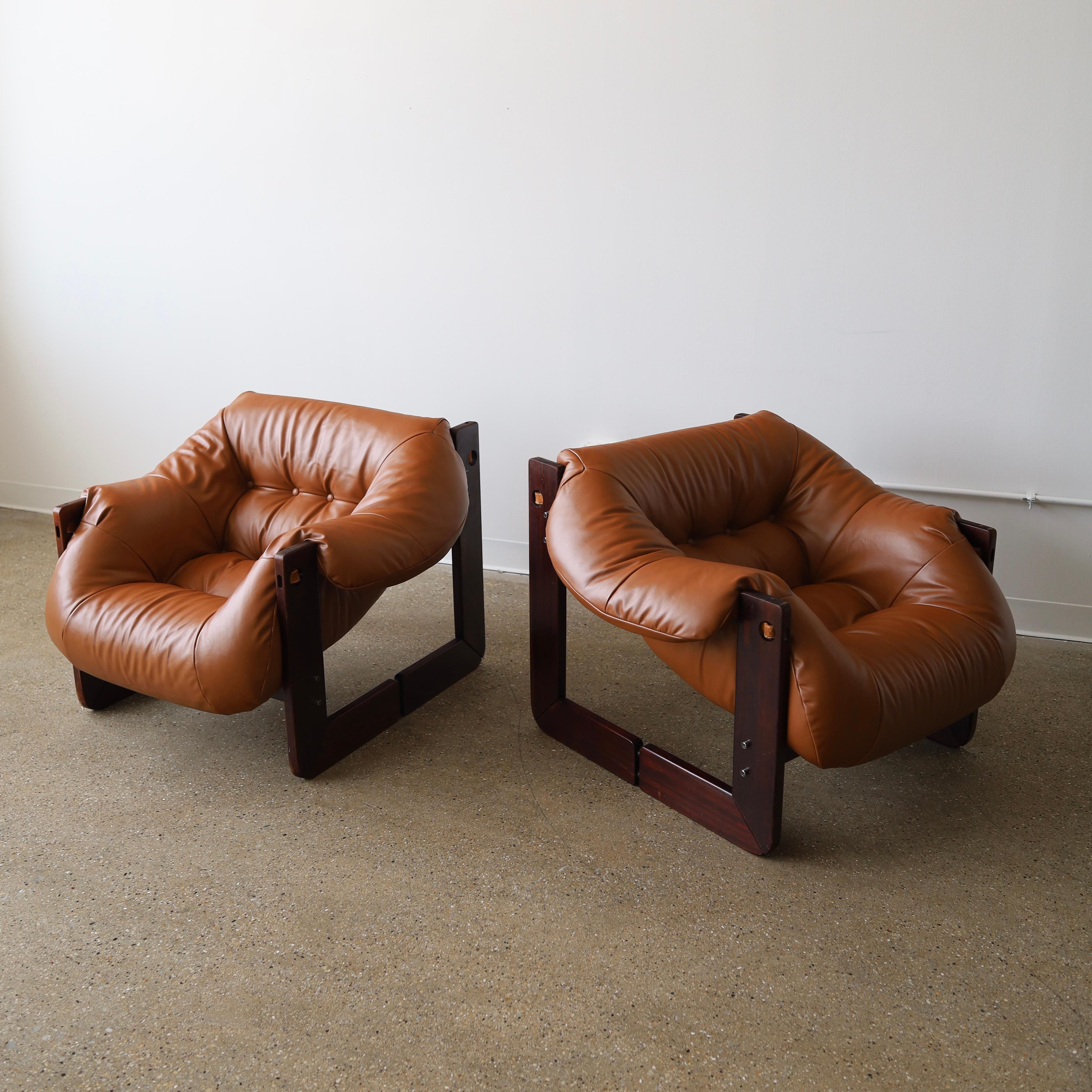 c. 1970s, Brazil. Both chairs have been fully reupholstered but feature the original finish on the wood. There is wear consistent with use on the frames including minor scuffs and losses to the finish. See photos for details 

