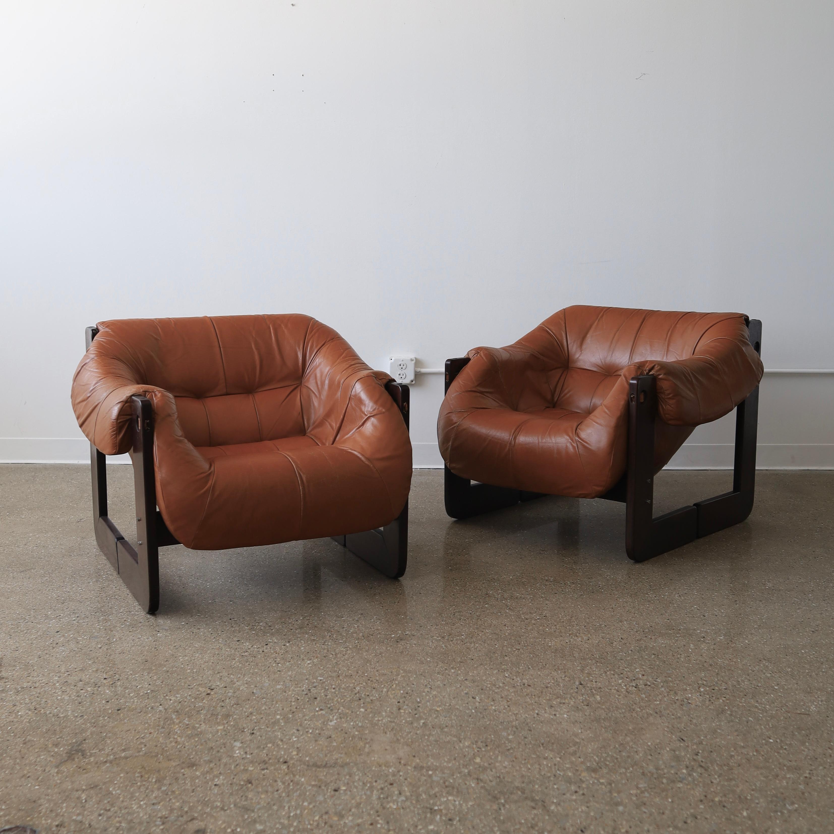 c. 1970s, Brazil featuring their original leather. There is wear consistent with use on the frames including minor scuffs, a crack on one chair, and losses to the finish. The leather also has wear commensurate with age - see photos for details 

