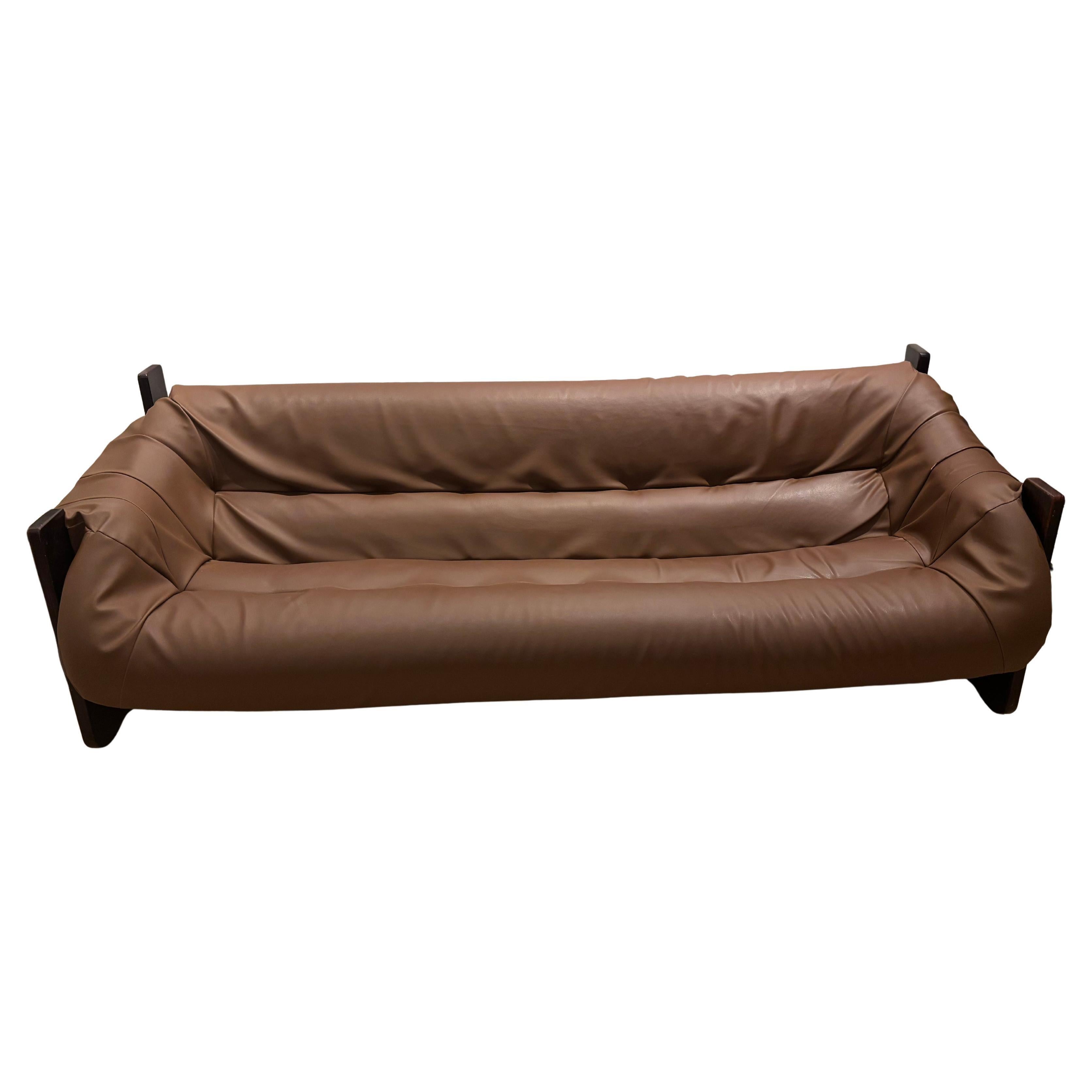 A stunning example of Brazilian modernism, this **MP-97 sofa by Percival Lafer** features the designer’s signature combination of comfort, craftsmanship, and sculptural form.

The sofa’s deep, hammock-like seat is supported by a solid hardwood frame