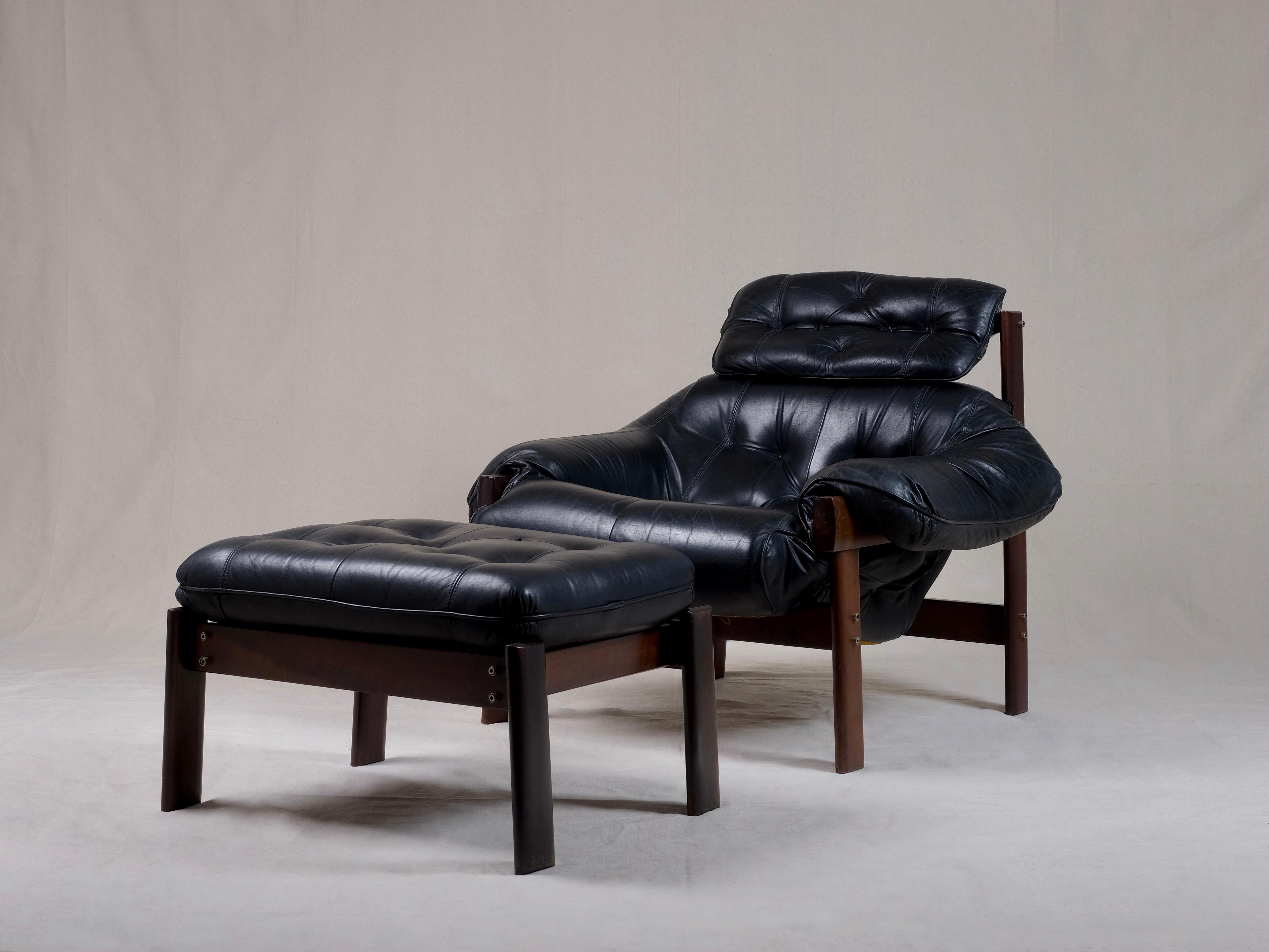 The MP-41 was designed by Percival Lafer in the 1960’s, Brazil.

 This chair features a solid dark hardwood base with leather straps to support the seat. The tufted leather seating is placed on top of the leather straps and the wooden frame, which