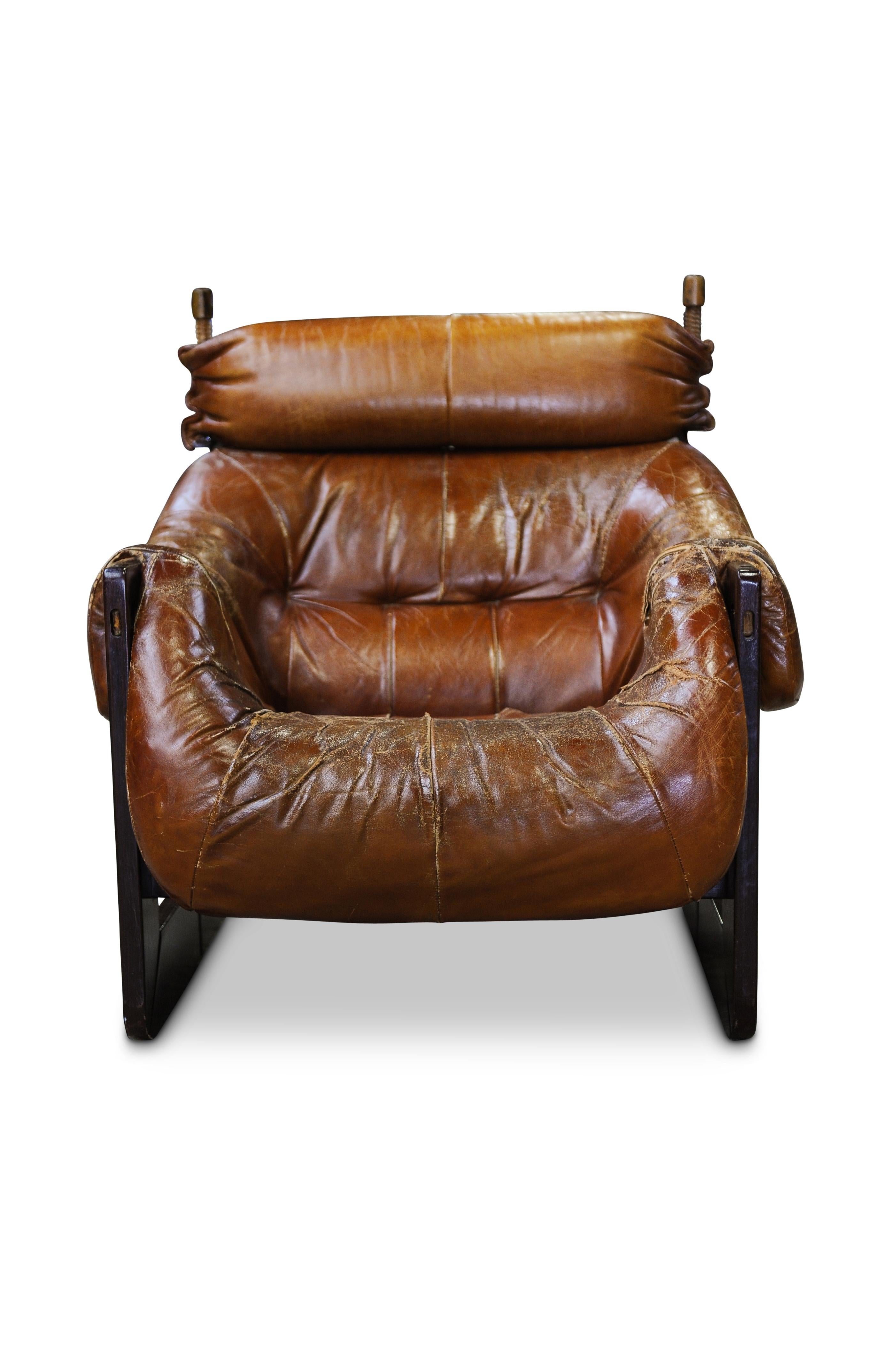 MP97 armchair with frame in Jatobah wood with rosewood finish and upholstered in glove leather by Percival Lafer, Brazilian, 1970s.

CITES Papers for chair available for selling to the US.

 Item has extensive wear to leather and seams requiring