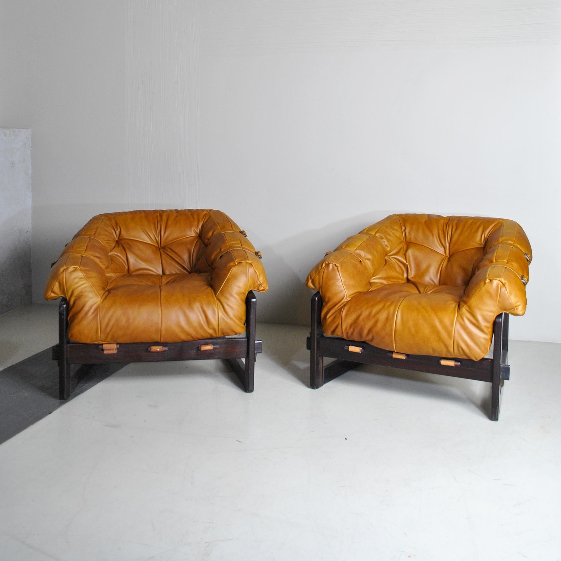 Fantastic vintage lounge chairs by Percival Lafer. Brazilian design and original leather. Really unique design and construction make this a true statement piece. the structure is very good but the skin and leather.
