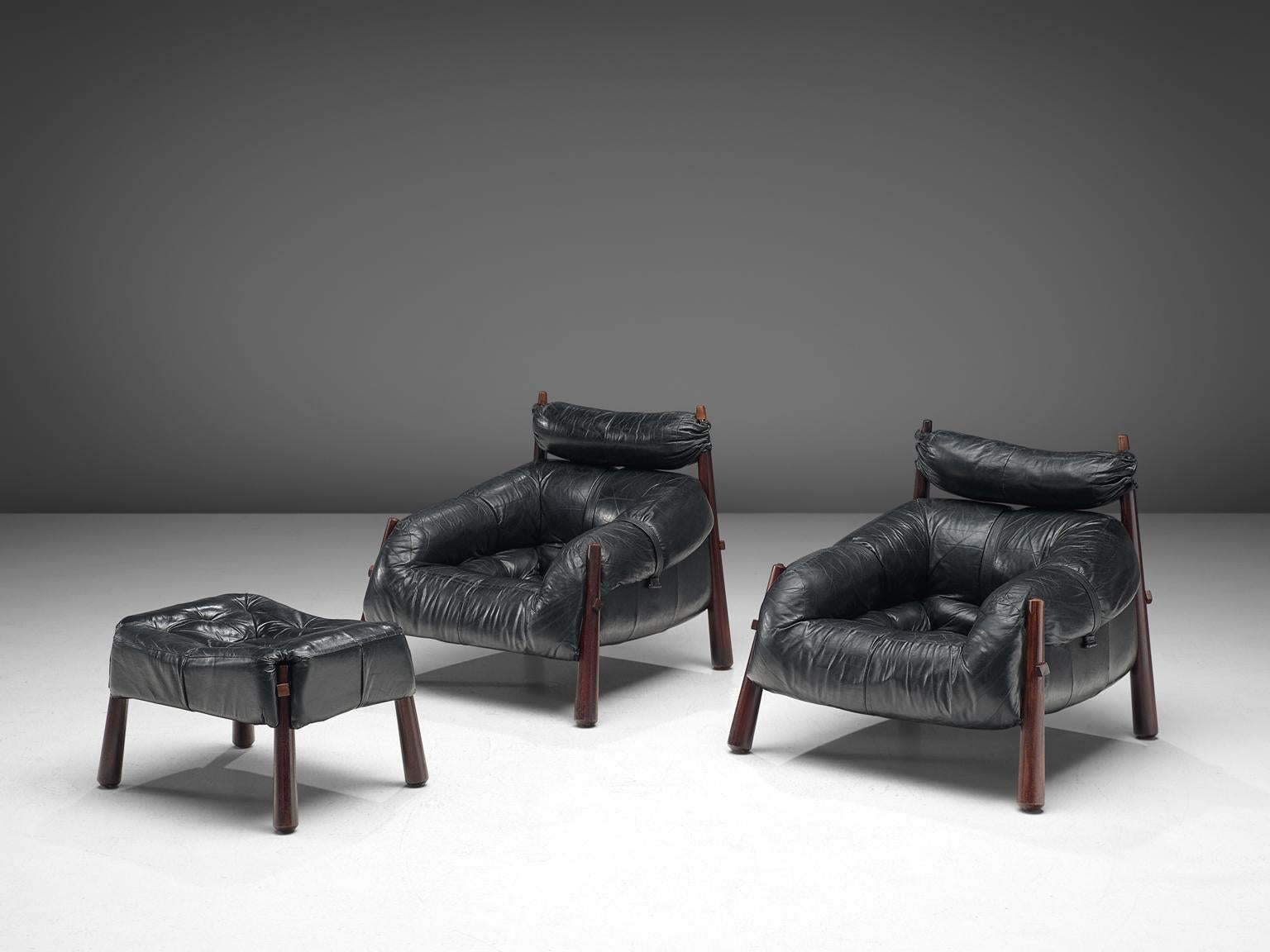 Percival Lafer, set of 2 lounge chairs with ottoman model MP-81, in rosewood and leather, Brazil, 1972.

Beautiful set of lounge chairs by Brazilian designer Percival Lafer. These chairs consist of a solid dark wooden base to which the leather