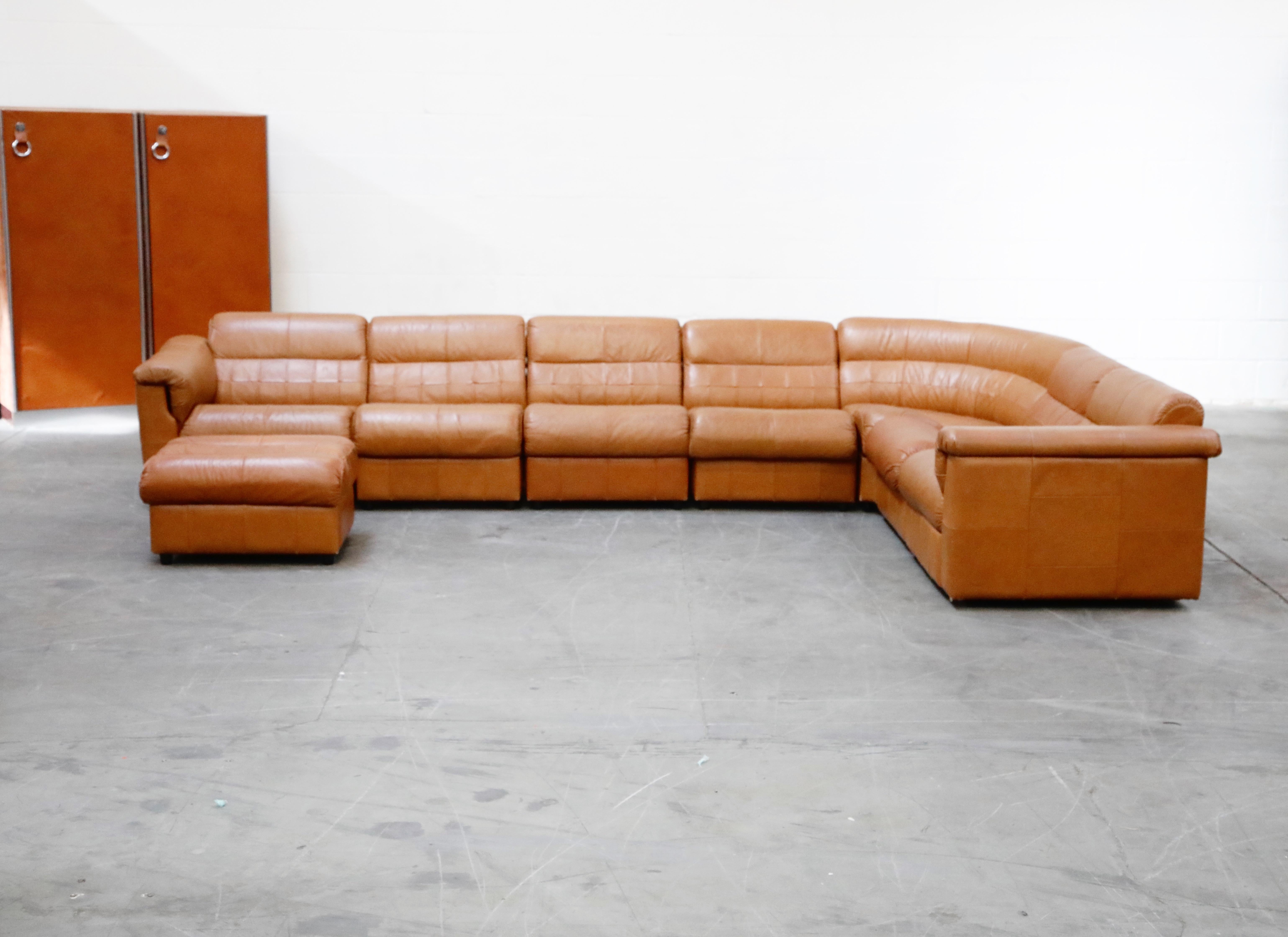 An impressive 1960s modular set of eight (8) sections of cognac brown patchwork leather sectional living room set by Brazilian Modern designer Percival Lafer, each section retains its original 'Lafer S.A.' / 'Made In Brazil' labels underneath. This