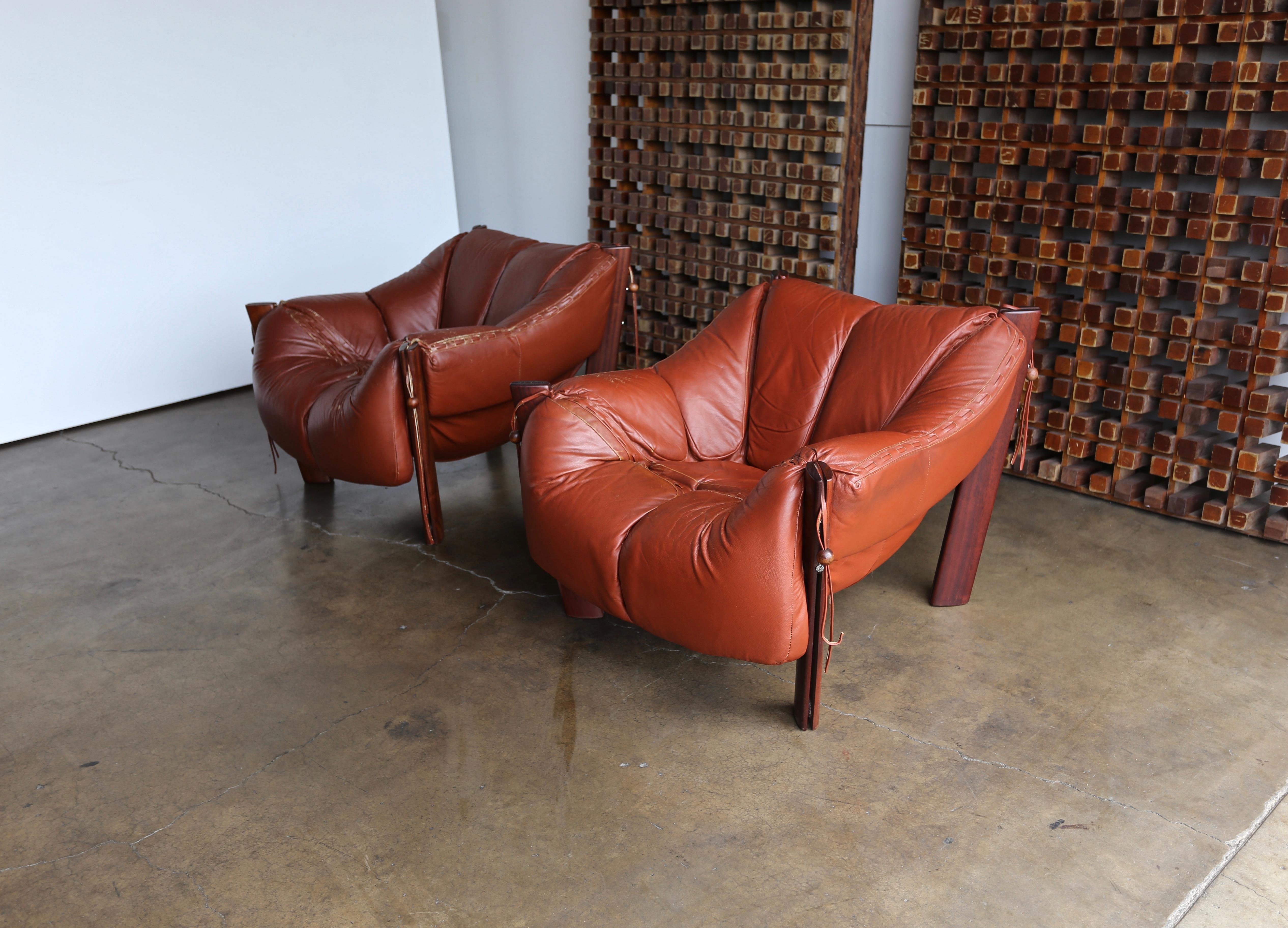 Percival Lafer rosewood and leather lounge chairs. A beautiful patina to the original leather.