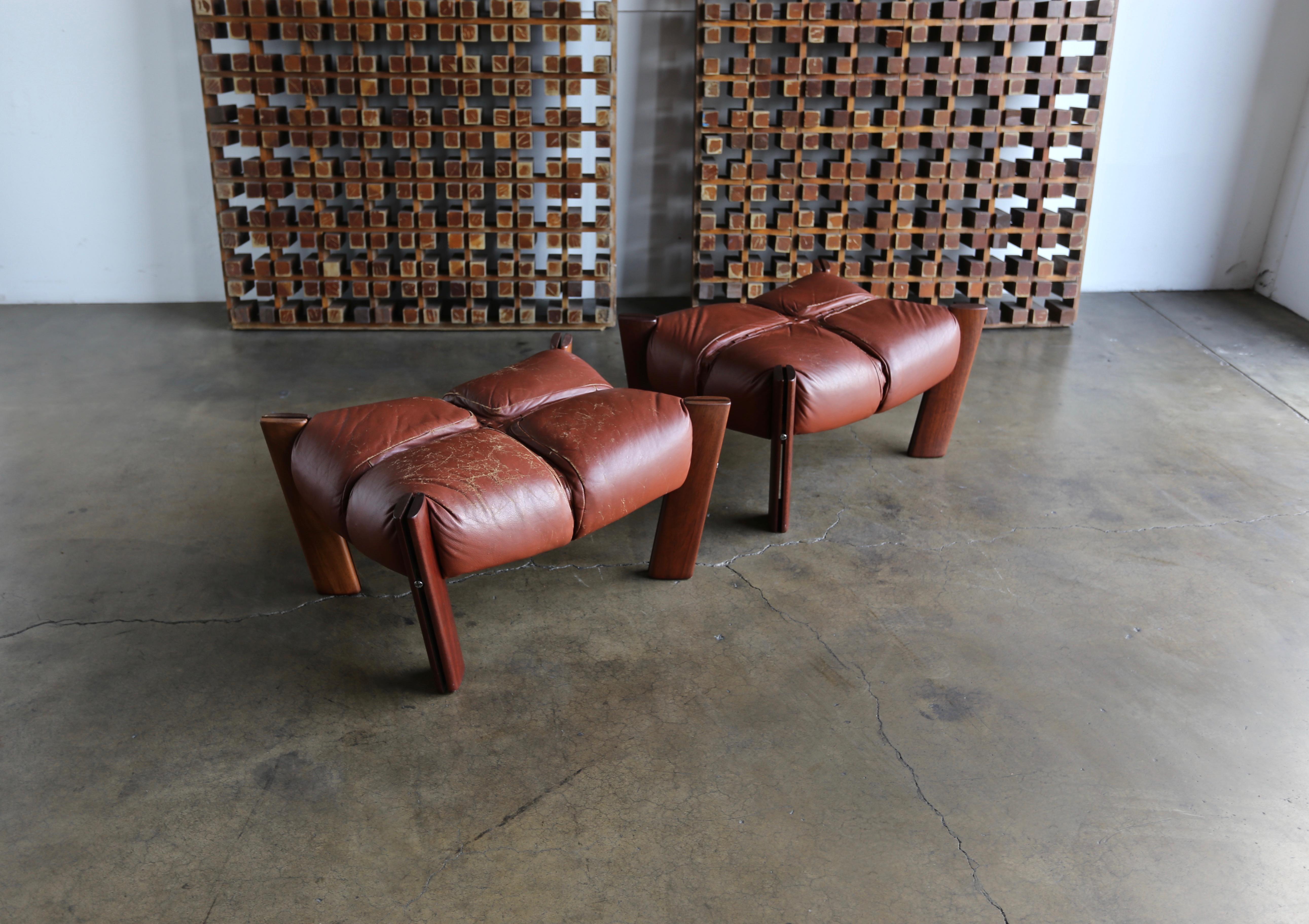 Percival Lafer rosewood and leather ottomans or stools. Beautiful patina to the original leather.