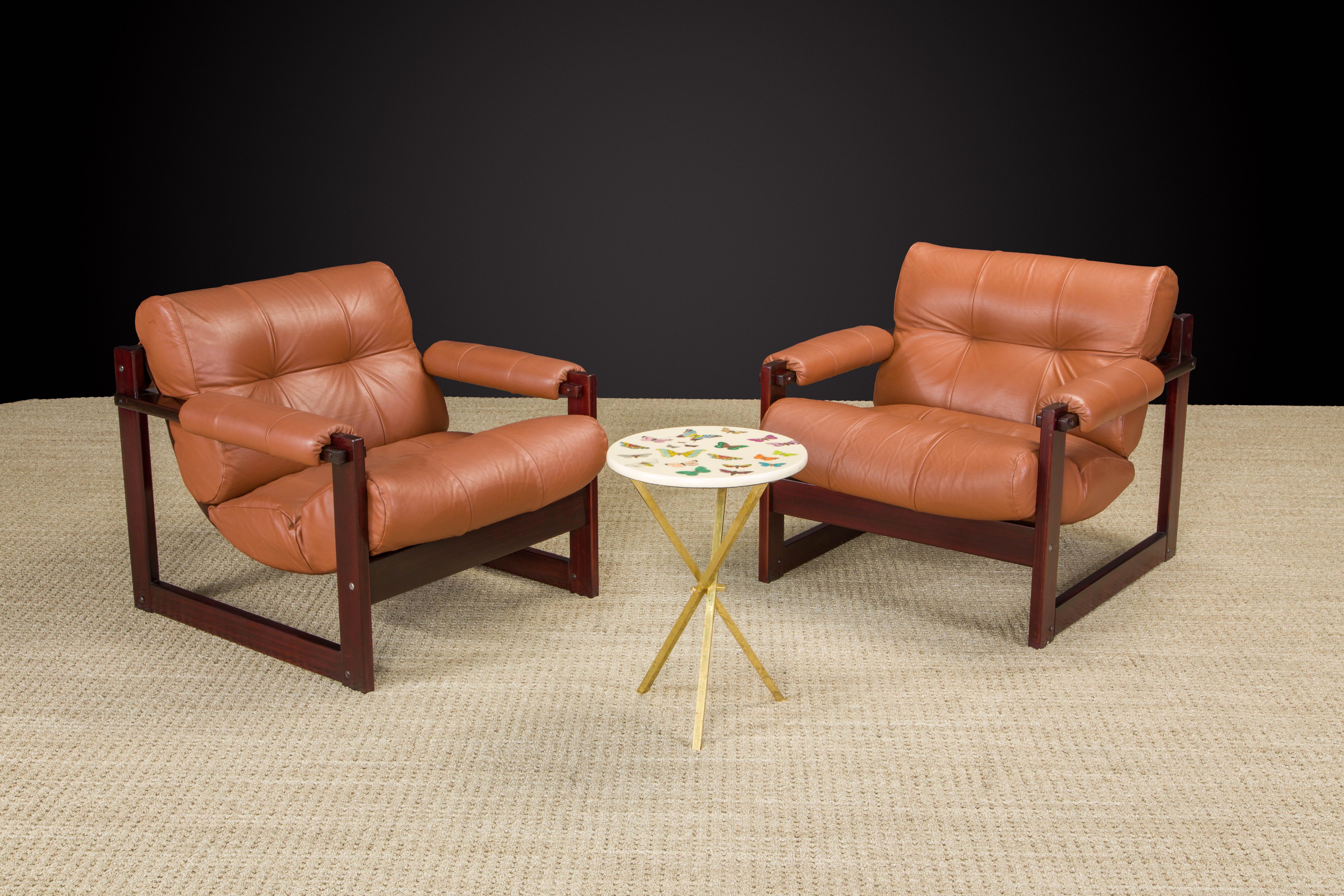 This gorgeous restored pair of 'S-1' cognac-color leather lounge chairs by Brazilian designer Percival Lafer for Lafer MP.  This set was designed in 1976 and was Lafer's concept of merging Brazilian design with Scandinavian sensibility - the sling