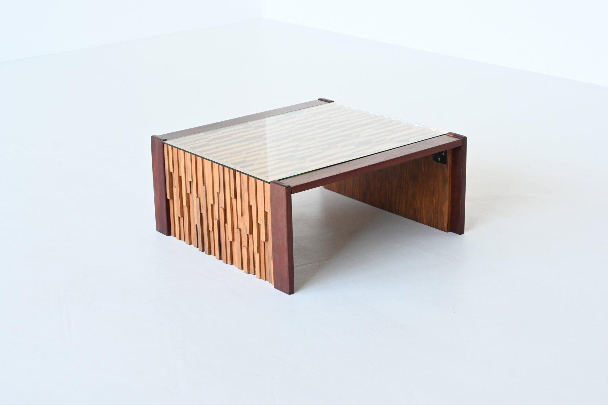 Beautiful sculptural coffee table designed and manufactured by Percival Lafer, Brazil 1960. This amazing piece is made of high quality different tropical hardwood that is very well crafted in different layers. The varying lengths of exotic wood