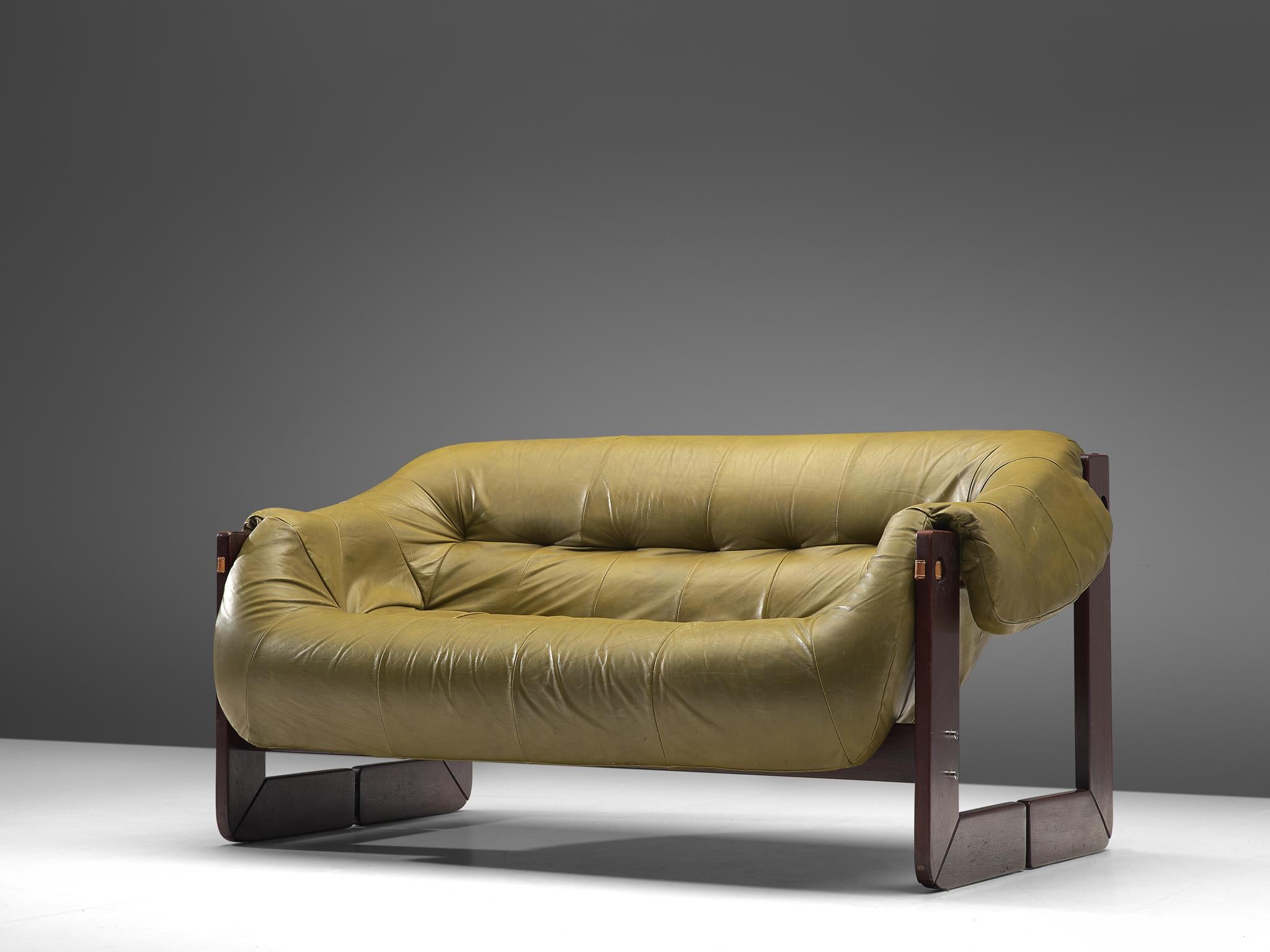 Percival Lafer, settee, leather, Brazilian hardwood and metal, Brazil, late 1960s

Bulky and voluptuous sofa by Brazilian designer Percival Lafer. This two-seat sofa features a solid dark wooden base with leather straps spanned between the slats.