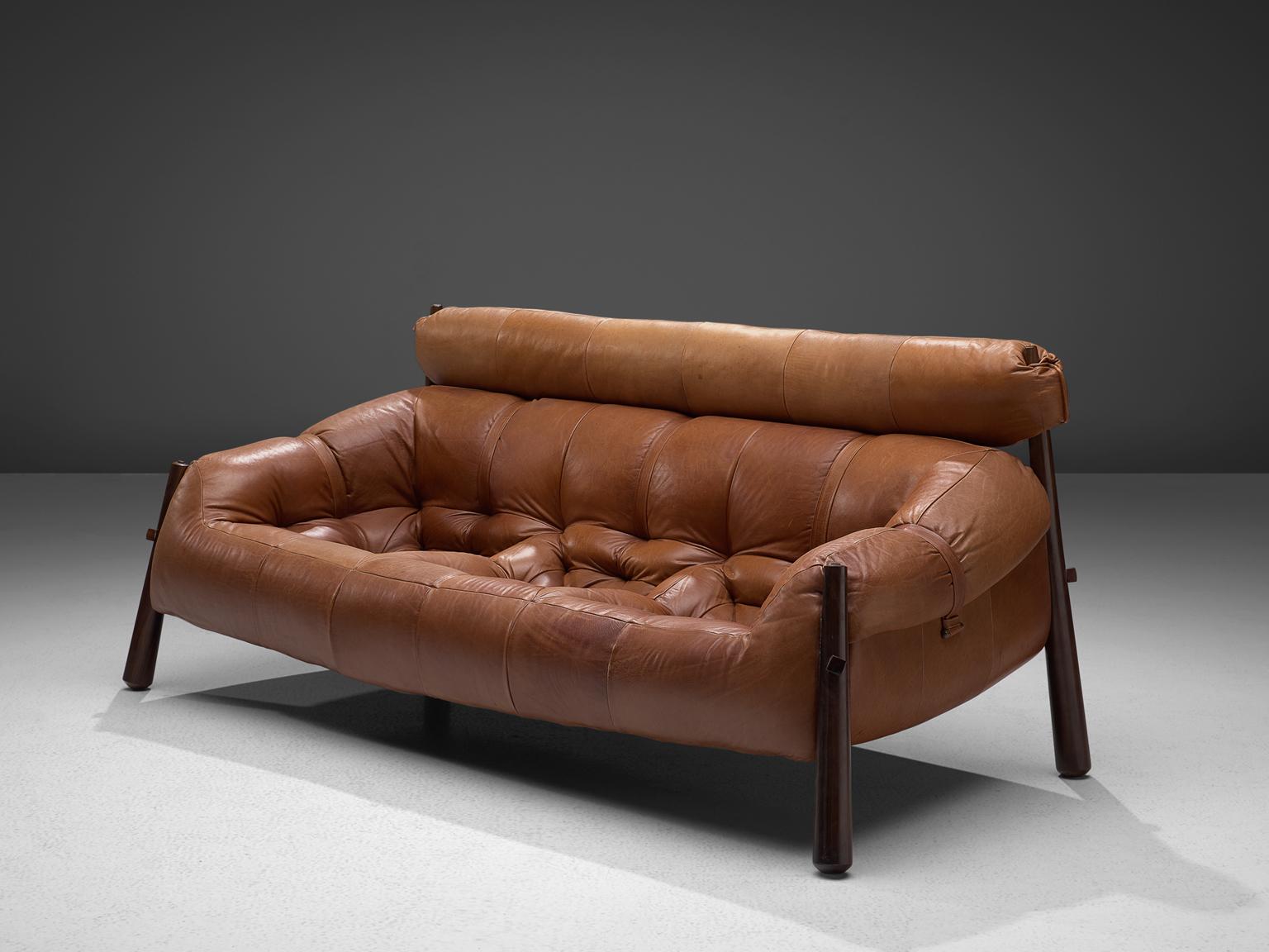 Percival Lafer, sofa model MP-81, in rosewood and leather, Brazil, 1972.

Beautiful sofa by Brazilian designer Percival Lafer. This sofa consists of a solid dark wooden base to which the leather seating is attached. The tufted cognac leather