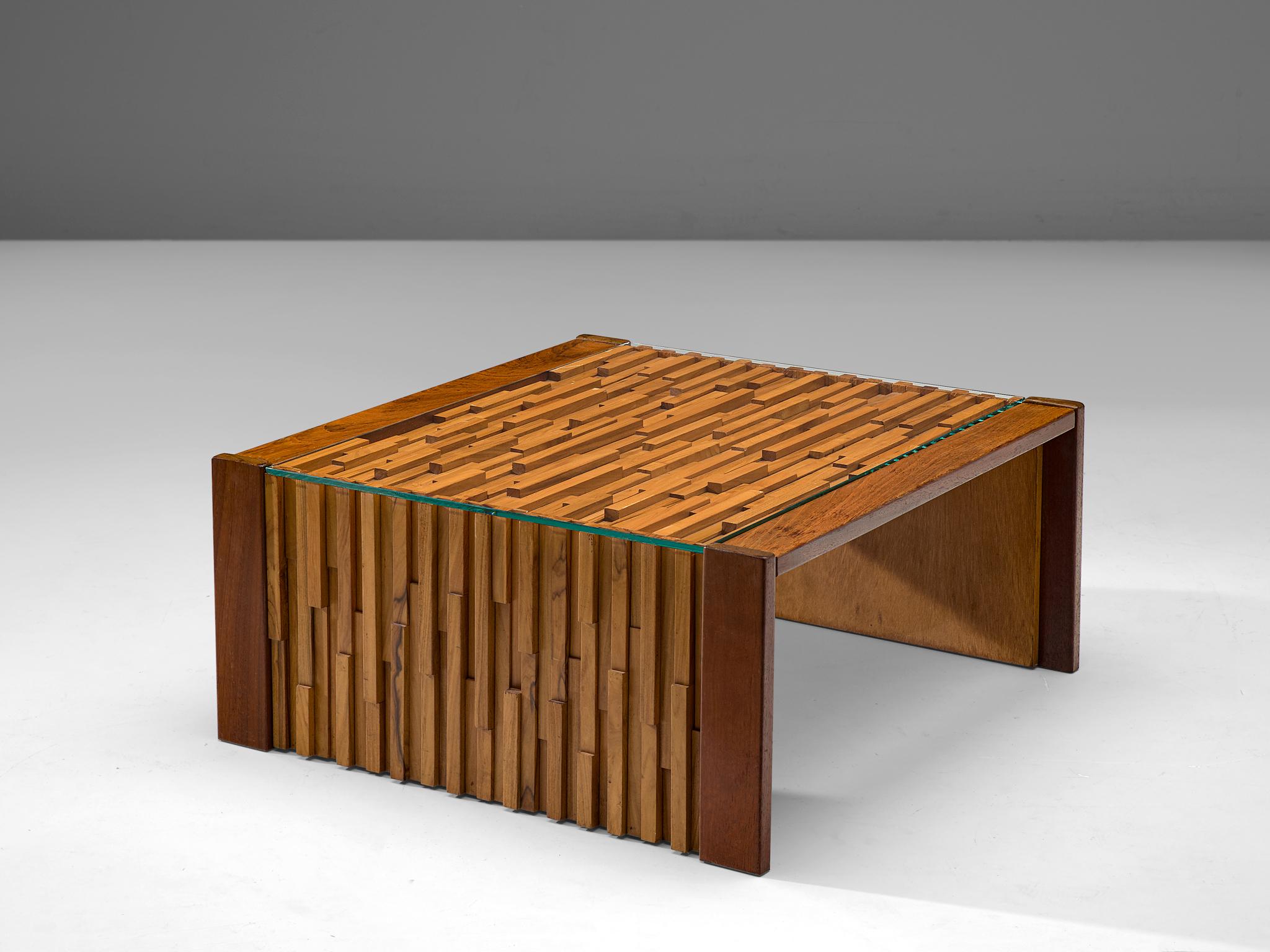 Percival Lafer, coffee table, glass, Brazilian hardwood and mahogany, Brazil, 1970s.

Amazing cocktail table by the Brazilian designer Percival Lafer. Highly sculptural design that is build up with pieces of Brazilian hardwood and mahogany. All