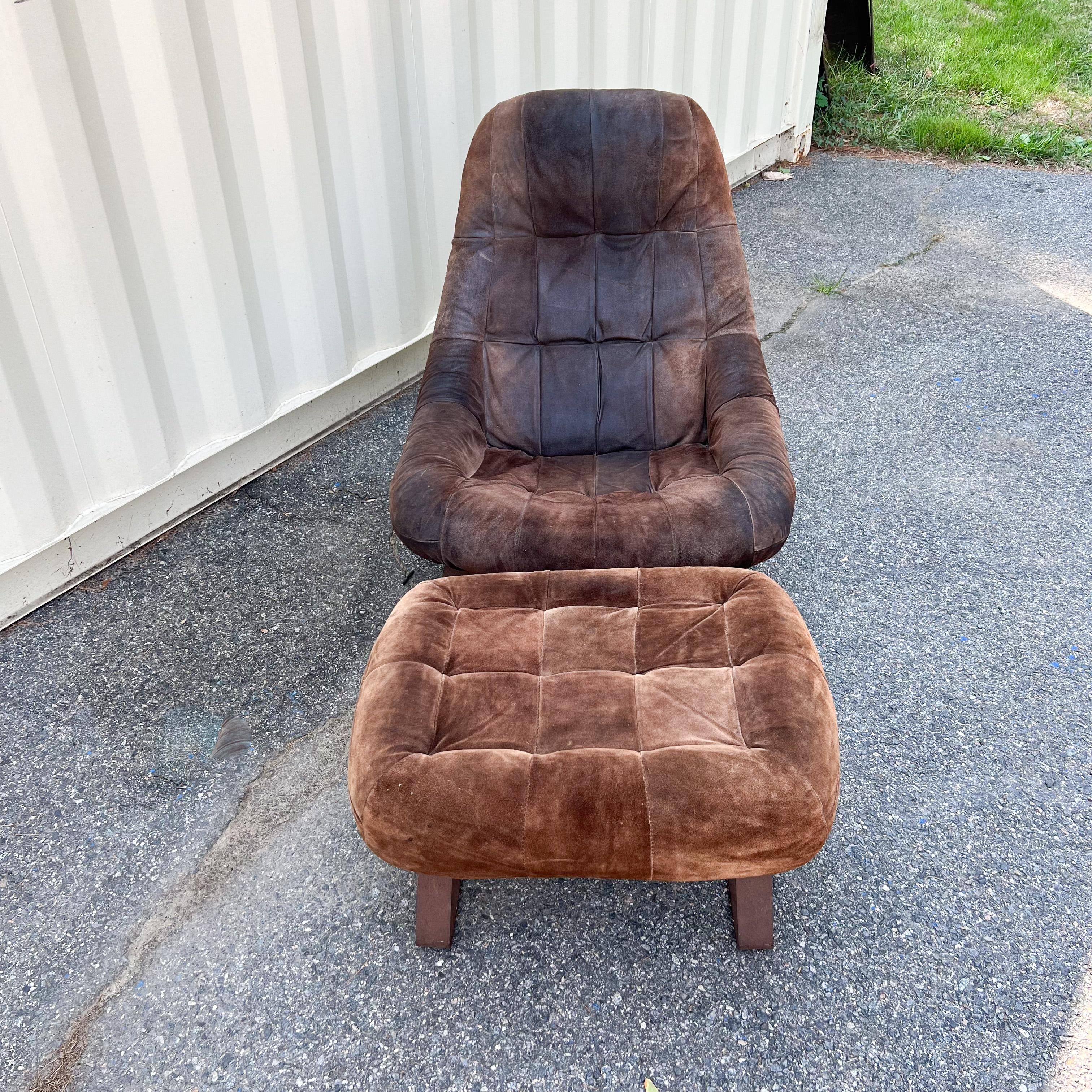 Mid-Century Modern Earth lounge chair and ottoman with original suede upholstery. Designed by Brazilian designer, Percival Lafer. The ottoman is a lighter brown hue than the chair. Some scuffing/fading/wear to the chair and ottoman as seen in