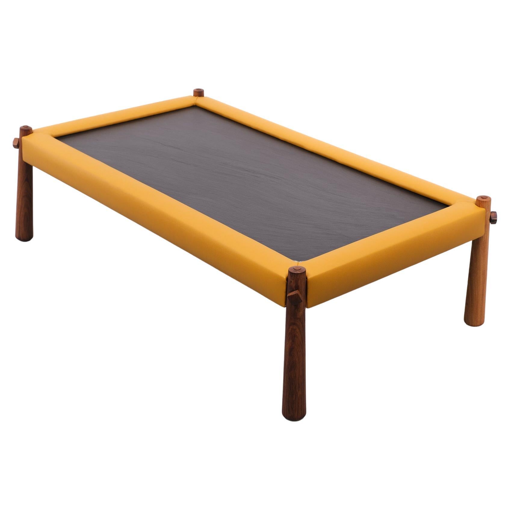 Beautiful Percival Lever Coffee table Newly upholstered Mustard Yellow color frame ,comes with a thick Solid Slate top. and is standing on solid Jacaranda wood legs. 
Stunning good looking table.