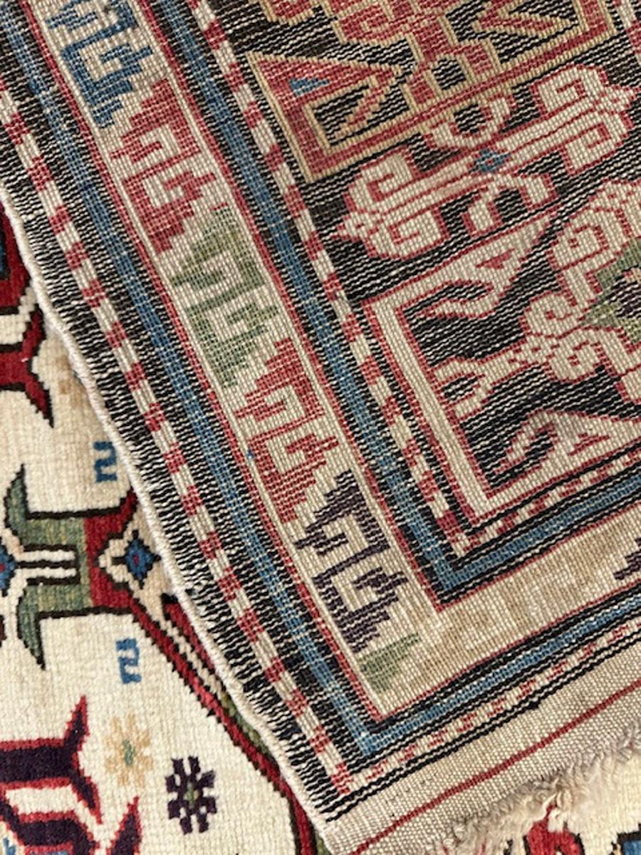Ivory ground Perepedil carpet from Kuba district,eastern Caucasus,west coast of the Caspian Sea.

Age: dated 1341=1922

Size: 10′.0″x4′.9″ (305×145 cm)

This unusually long ivory Perepedil prayer rug displays a faceted niche arch at one end along