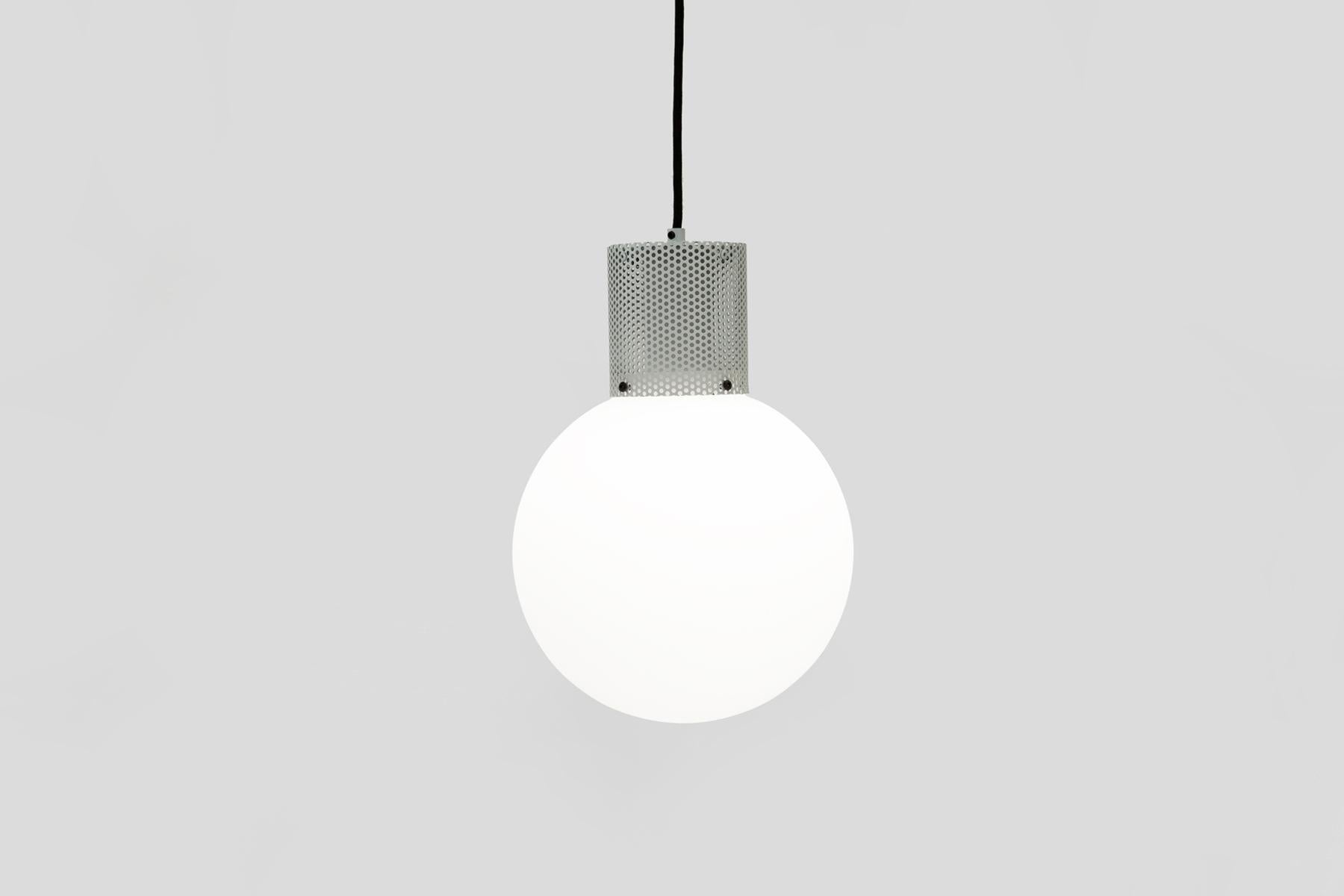 Australian Perf Pendant Light, Large Matte Black Perforated Tube, Glass Round Orb Shade For Sale