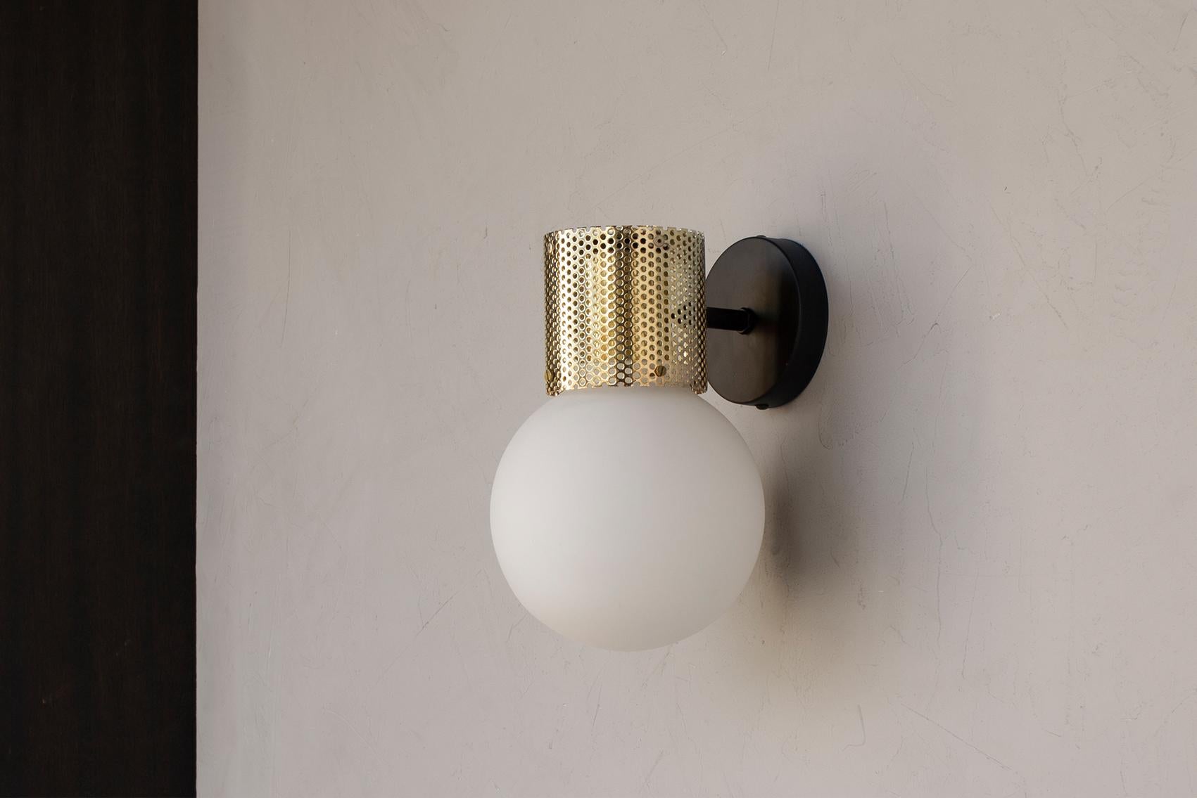 Contemporary Perf Wall Sconce, Off-White Perforated Tube, Glass Round Orb Shade For Sale
