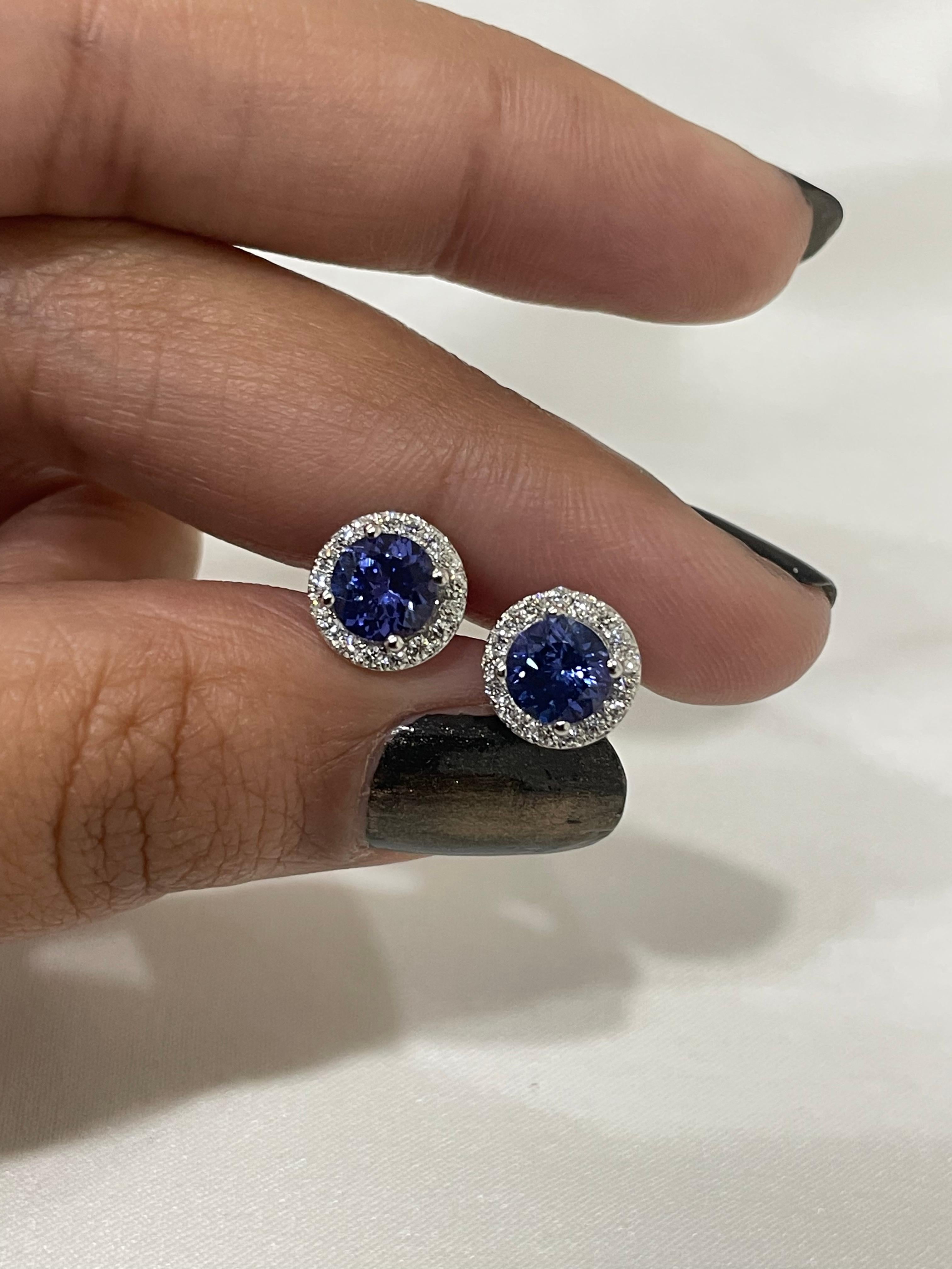 Studs create a subtle beauty while showcasing the colors of the natural precious gemstones and illuminating diamonds making a statement.

Round cut tanzanite studs with diamonds in 18K gold. Embrace your look with these stunning pair of earrings