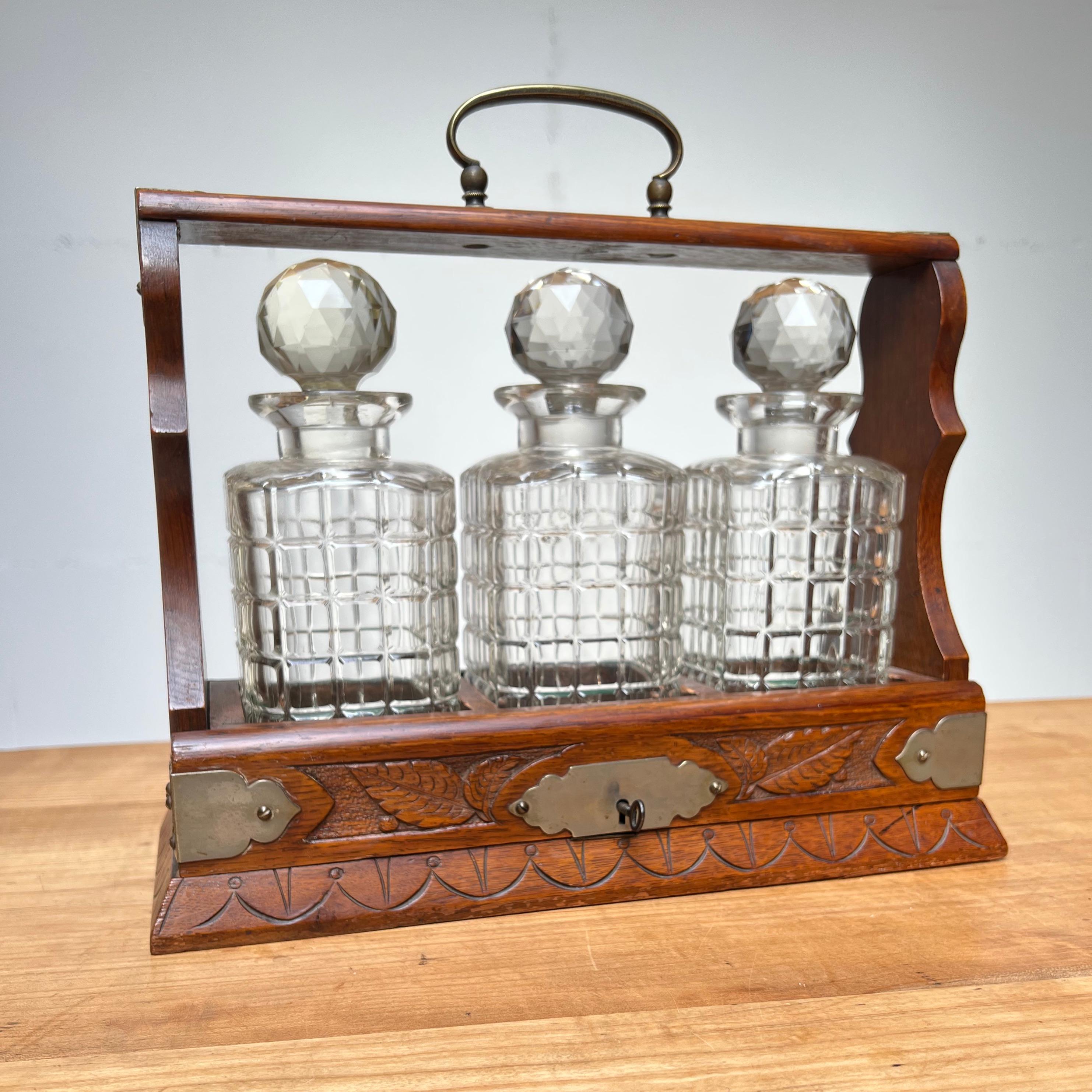 Good size and fine design, antique tantalus

This amazing condition and rare, three crystal bottles holding, tiger oak tantalus will look great everywhere. This handcrafted work of beauty dates from the early 1900s and it comes with beautiful