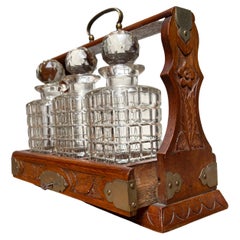 Perfect Carved Oak & Brass Tantalus with Whiskey or Liqueur Crystal Decanters