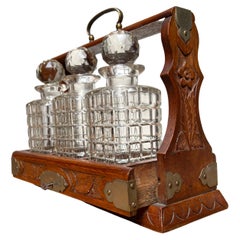 Antique Perfect Carved Oak & Brass Tantalus with Whiskey or Liqueur Crystal Decanters