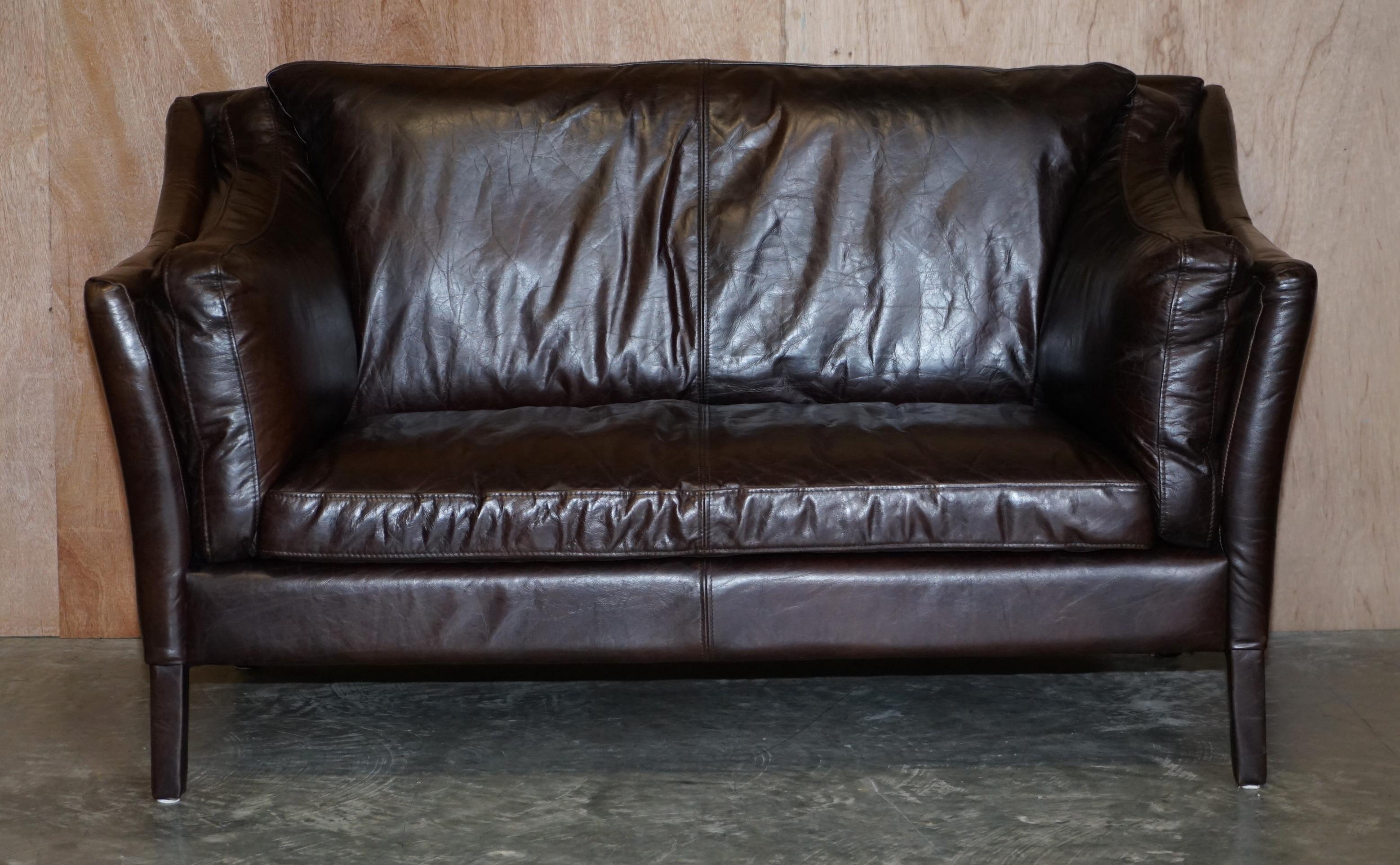 We are delighted to offer this perfect condition Halo Biker tan brown leather small two seat sofa

This sofa is in pretty much perfect condition, it doesn’t look to have been used, we have cleaned waxed and polished it from top to bottom. Bike tan