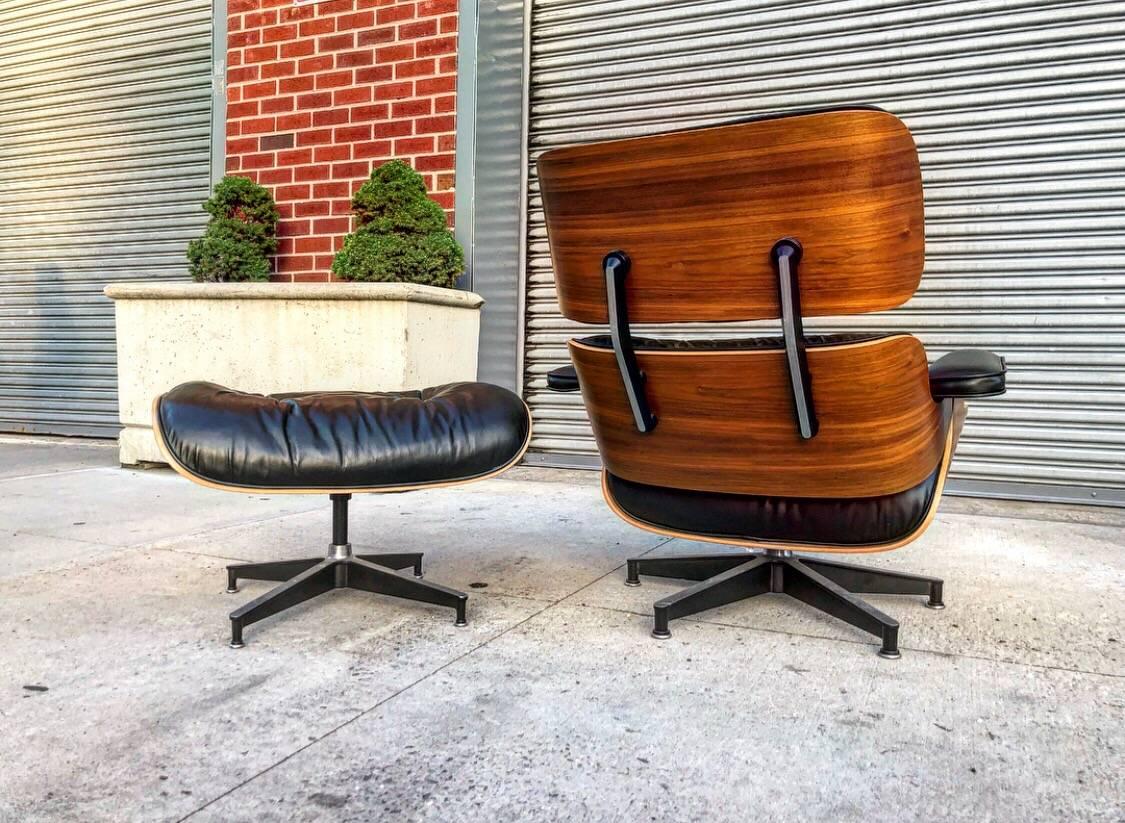 Perfect Herman Miller Eames lounge chair and ottoman. Signed with original manufacturers tag. Gorgeous deep walnut that read more like Brazilian rosewood. No damage besides normal wear from use. Even color throughout leather and wood with no sun