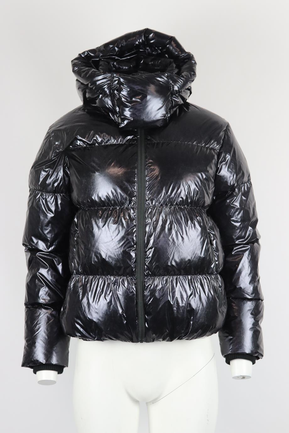 Perfect Moment hooded quilted padded shell down jacket. Black. Long sleeve, turtleneck. Zip fastening at front. 100% nylon; filling: 90% down, 10% feathers. Size: XSmall (UK 6, US 2, FR 34, IT 38) Shoulders: 17.4 in, Bust: 40.7 in, Waist: 39 in,