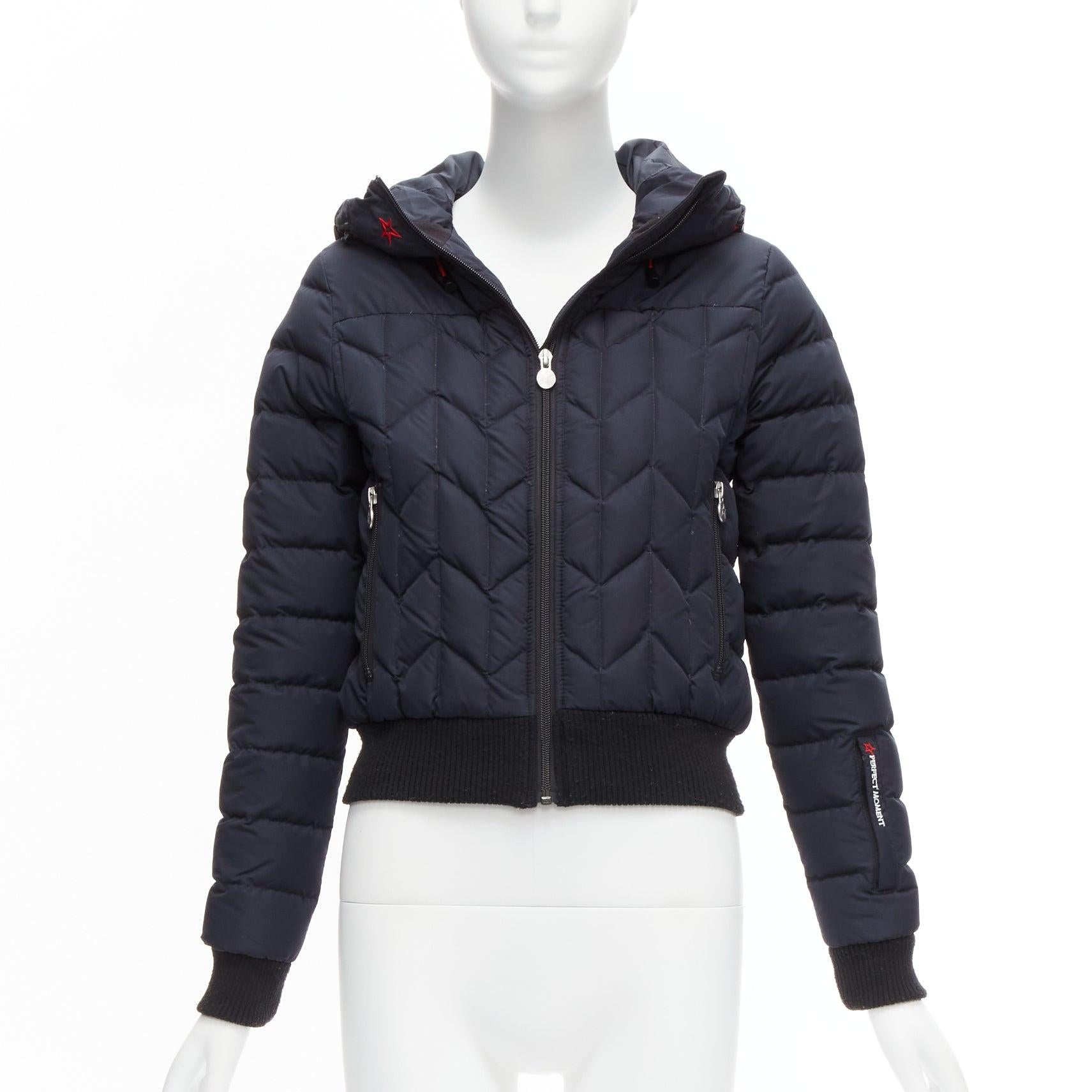 PERFECT MOMENT red logo navy blue chevron quilted hooded puffer jacket XS
Reference: SNKO/A00264
Brand: Perfect moment
Material: Nylon
Color: Navy, Red
Pattern: Solid
Closure: Zip
Lining: Black Fabric
Extra Details: Front zip closure. Inside pockets