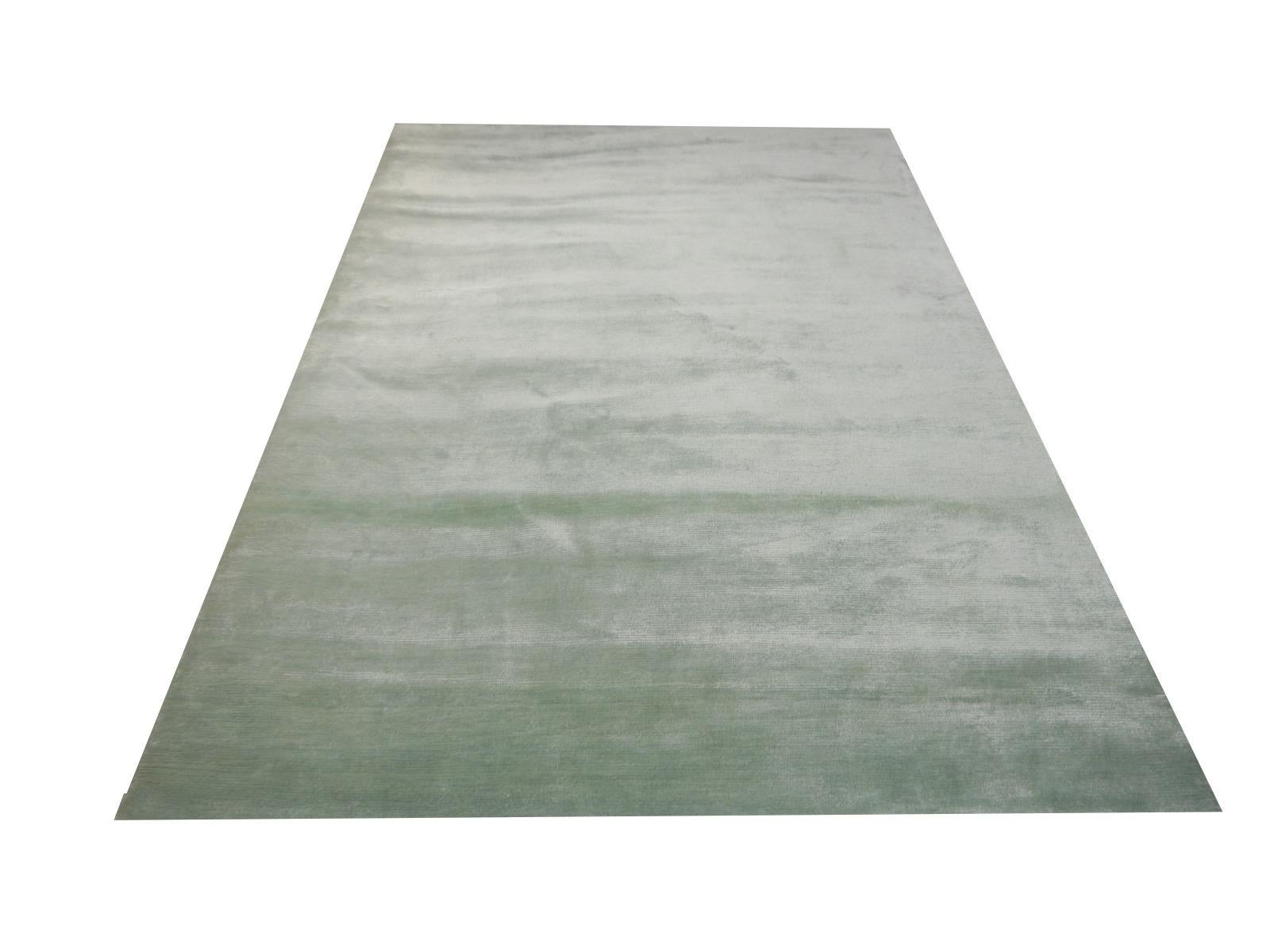 Perfect plain rug Collection color ice water in bamboo silk by Djoharian Design

This contemporary plain rug design from the Djoharian Collection is hand knotted in extra fine 100 knot per square inch quality, all made of hand spun bamboo silk.