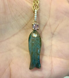 Perfect Poisson Carves Labradorite Fish Pendant with Diamonds 
Pink Spinel