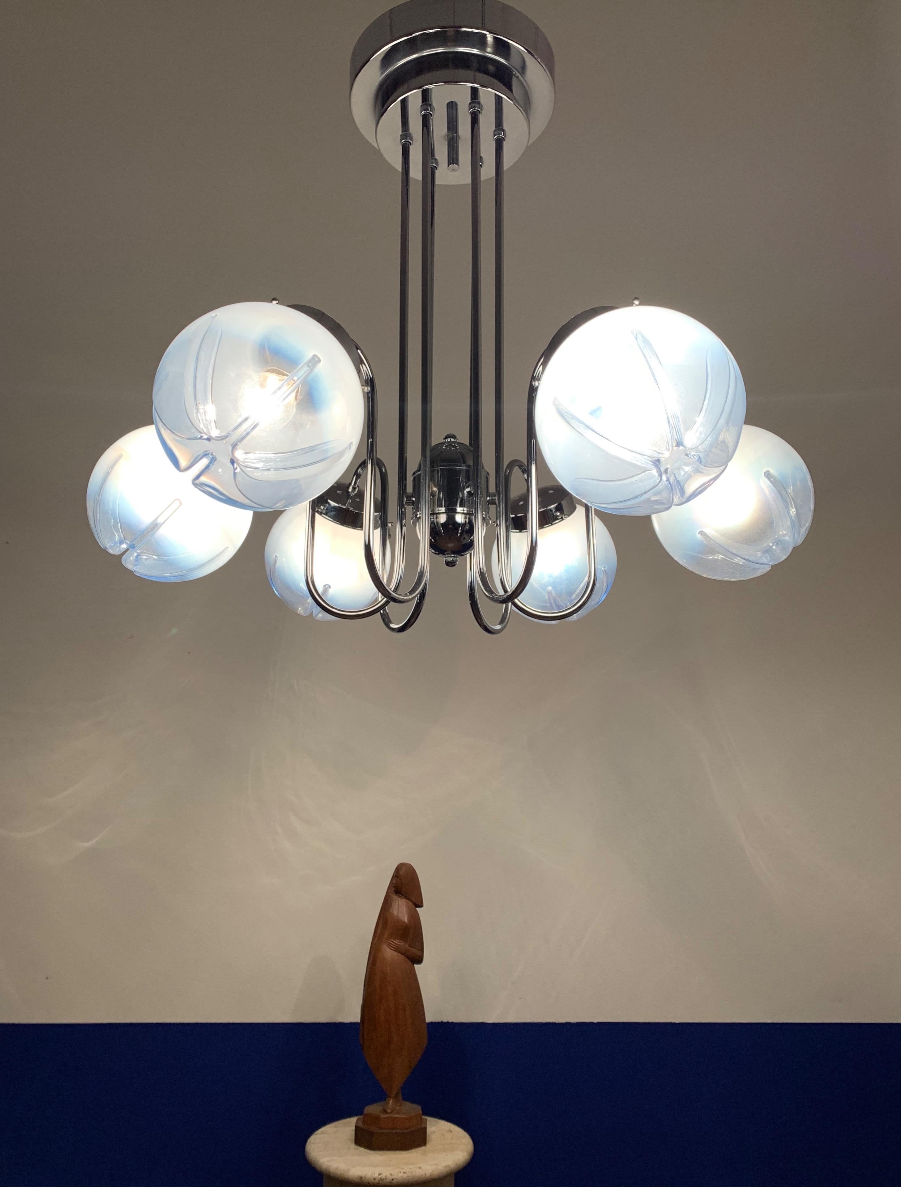 Wonderful design and practical size chrome with striking glass shades pendant.

If you are looking for a rare and voguish fixture to grace your home then this handcrafted midcentury chandelier could be your perfect lighting solution. One of our