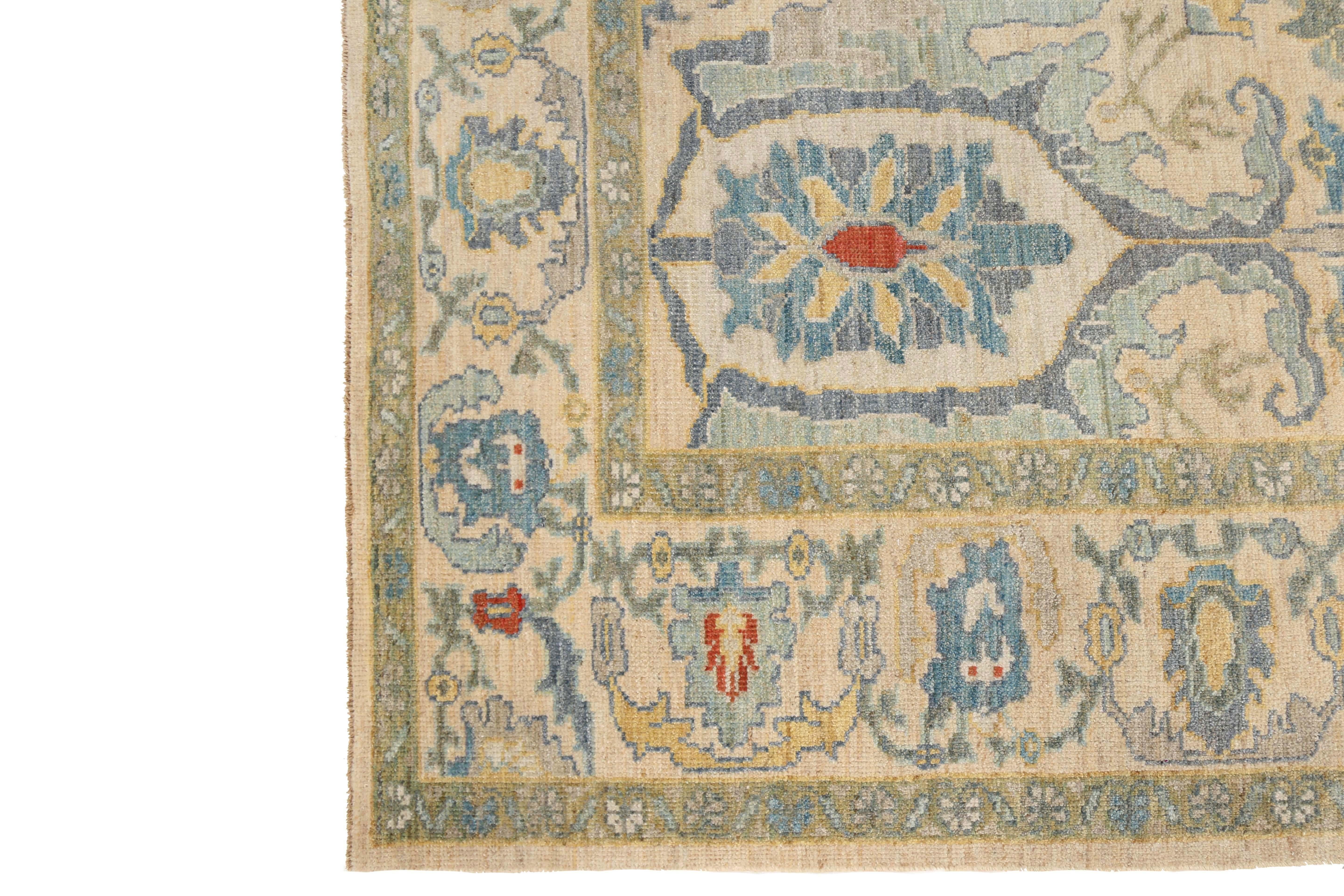 Introducing our stunning handmade Turkish Sultanabad rug, measuring 9'1'' by 12'0''! This exquisite piece features a cream background with vibrant pops of yellow, blue, navy, and red in the intricate design. The visible border seamlessly blends into