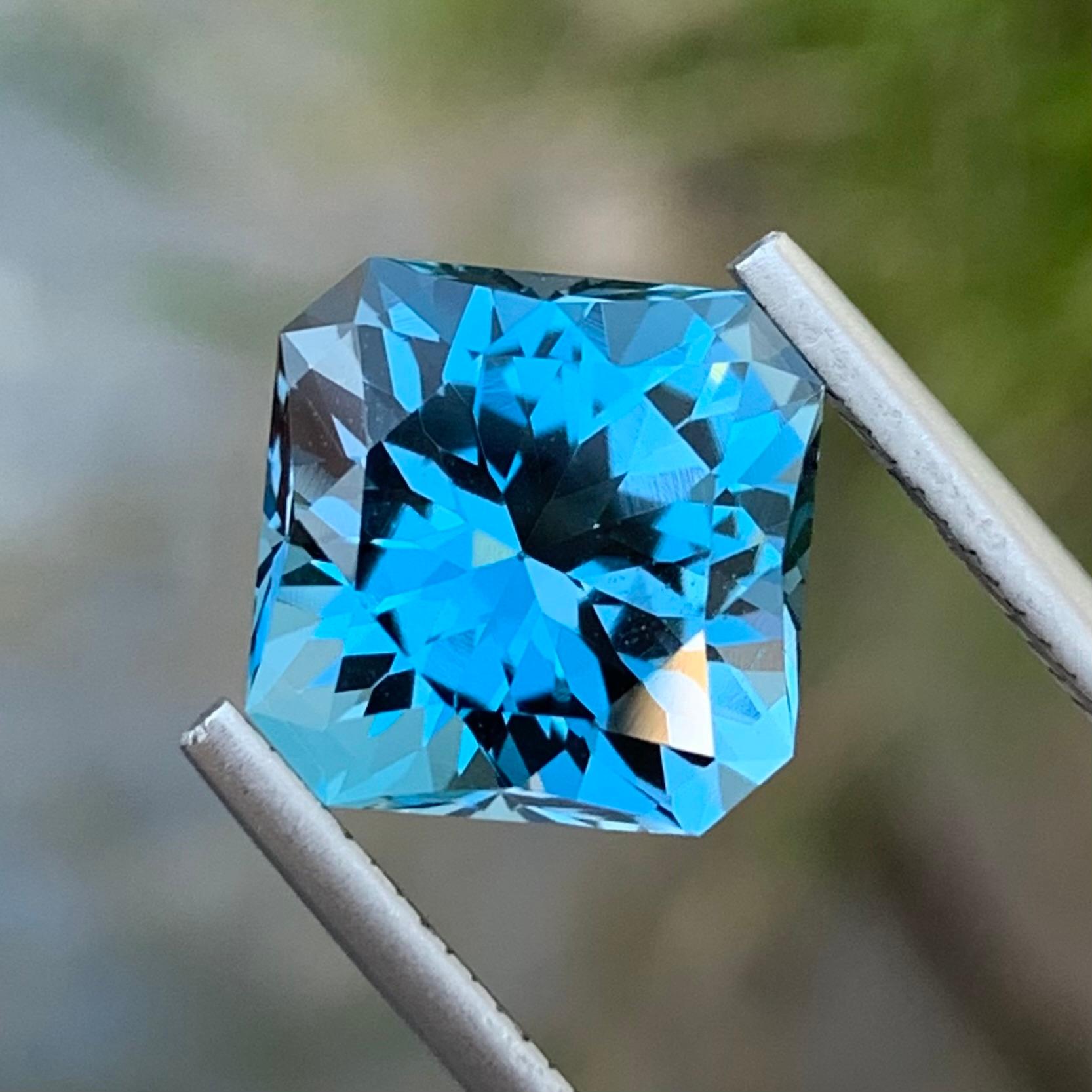 Loose London Blue Topaz 
Weight: 8.20 Carats 
Dimension: 10.6 x 10.6 x 8.4 Mm
Shape: Square 
Cut: Fancy 
Certificate: On Demand 
Origin: Brazil

London Blue Topaz, a captivating gemstone renowned for its rich, deep blue hue, stands out as a