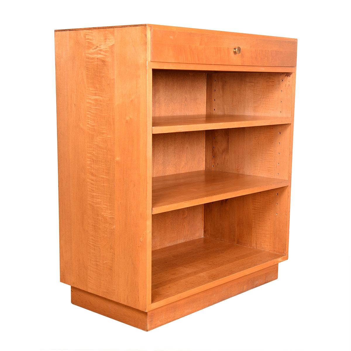 Great bookcase by Paul McCobb wit drawer on top.
Wonderful size with nice storage capacity in a small space.

