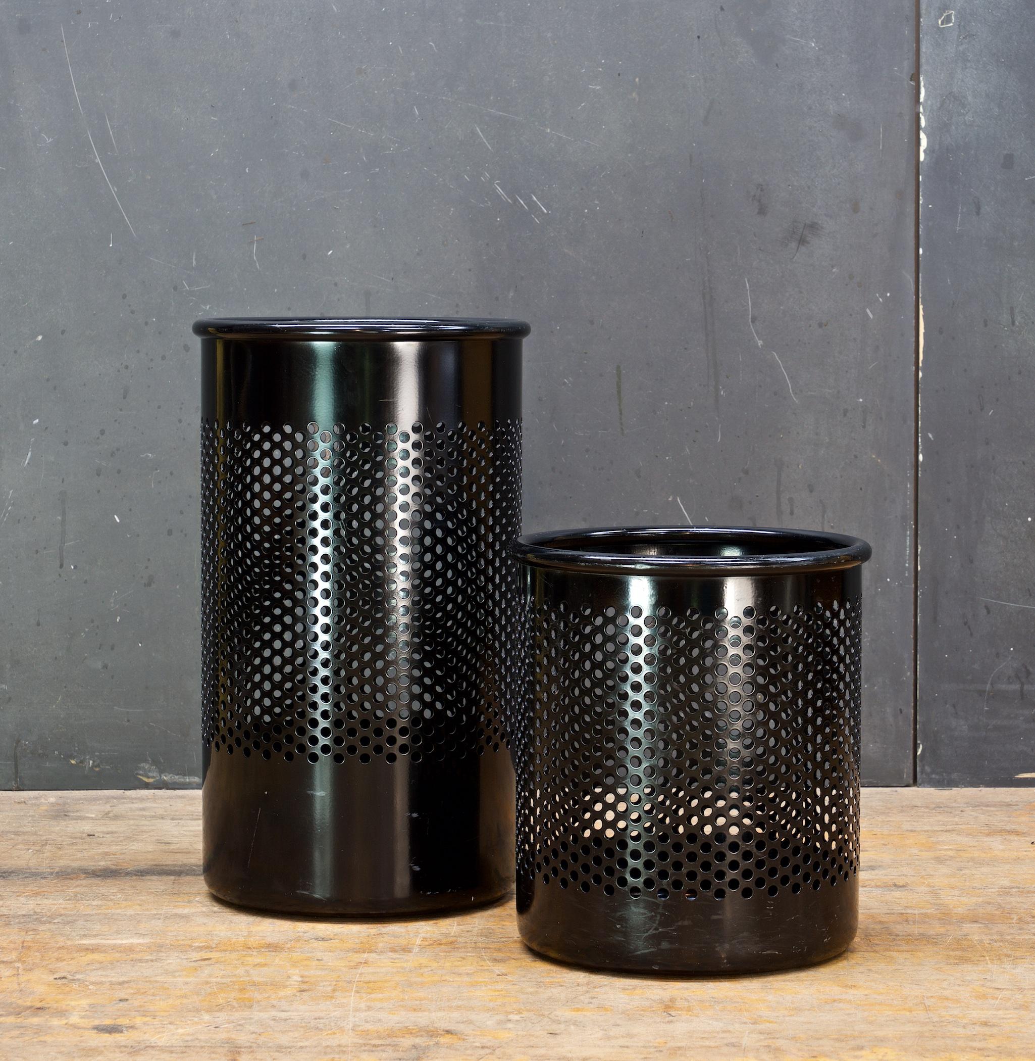 Pair. Well used. Simple but in the Memphis style and in the manner of Ettore Sottsass. A very Iconic late 20th century design, circa 1980s, black. 18 inches, and 11.75 inches in heights with diameters of 10.5.




 