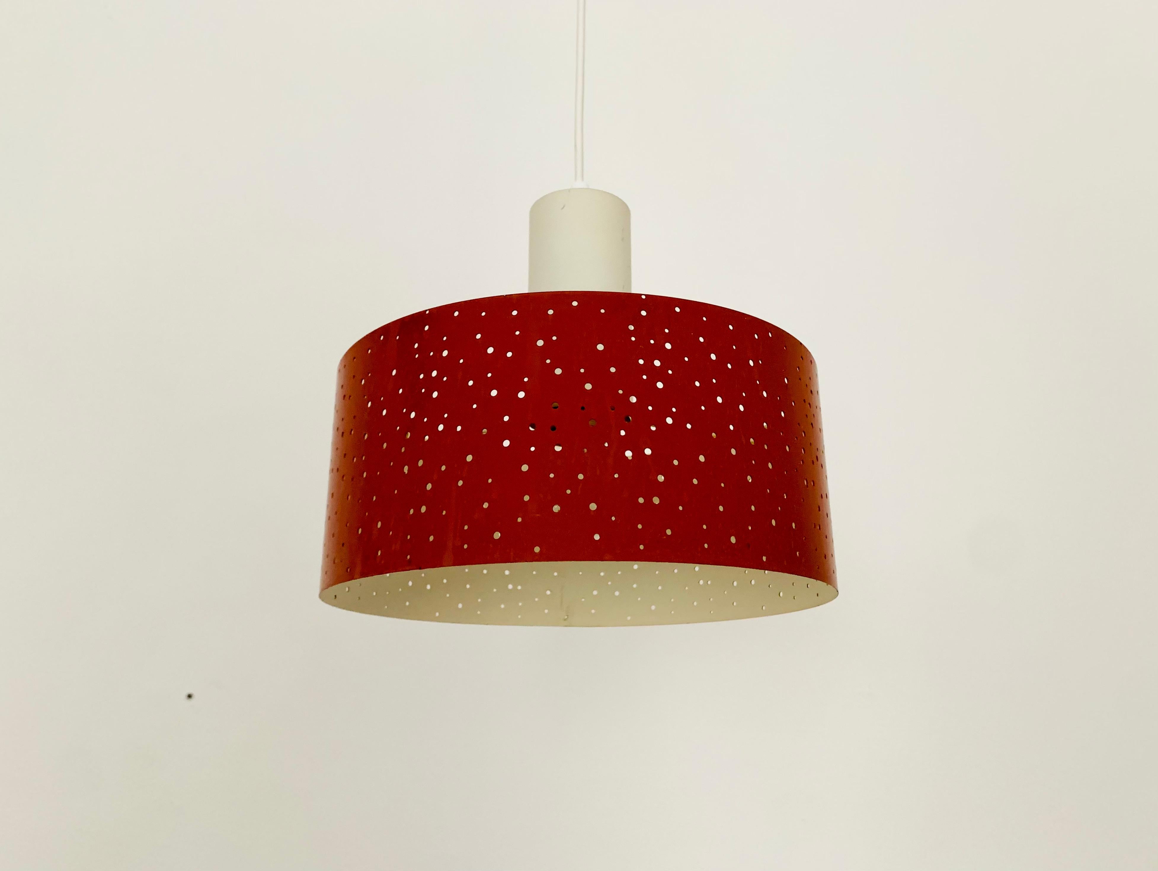 Very nice pendant lamp from the 1950s.
The lighting effect of the lamp is extremely beautiful.
The design creates a very elegant and pleasant light.
The lamp creates a very cozy atmosphere.

Design: Ernst Igl
Manufacturer: