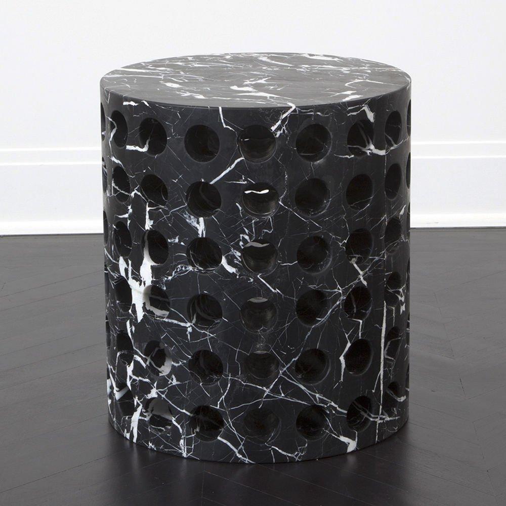 Hand-sculpted out of a block of solid Nero Marquina marble, this simple, versatile design can be used as a seat, stool, plinth, or an occasional table and is perfect for a shower or garden. The cylindrical form is an exceptional canvas to highlight