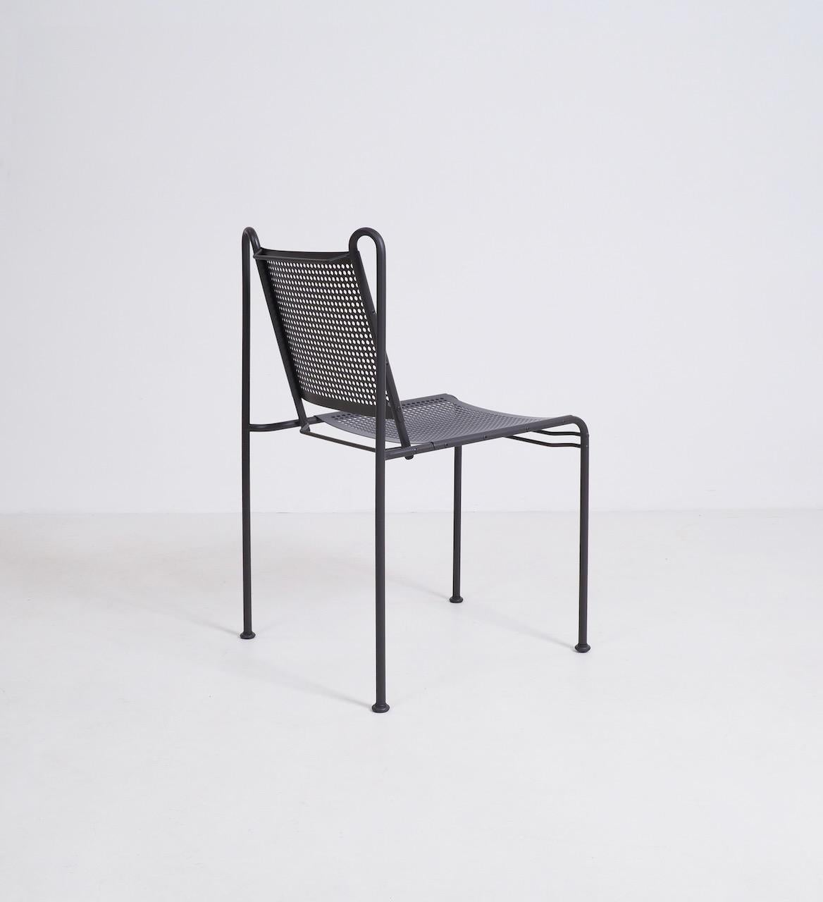Unusual, perforated steel side chair, circa 1970. Painted in a dark grey with a subtle brown tone. Unattributed. 

2 available. Priced per chair.

Dimensions (cm, approx):
height: 84
width: 50
depth: 50.
 