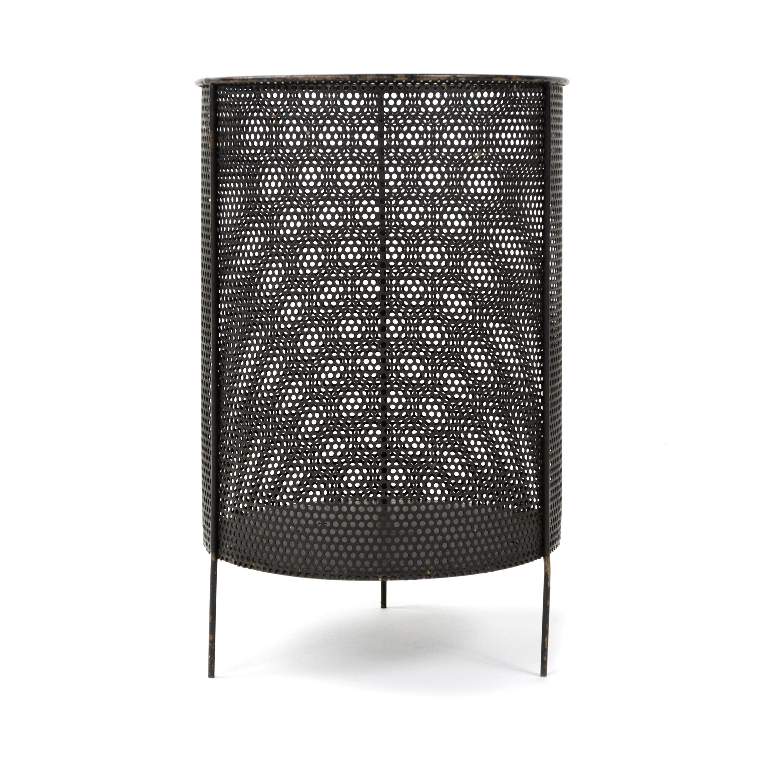 A perforated steel wastebasket on three legs designed by Mathieu Mategot. Made in France, circa 1950s.