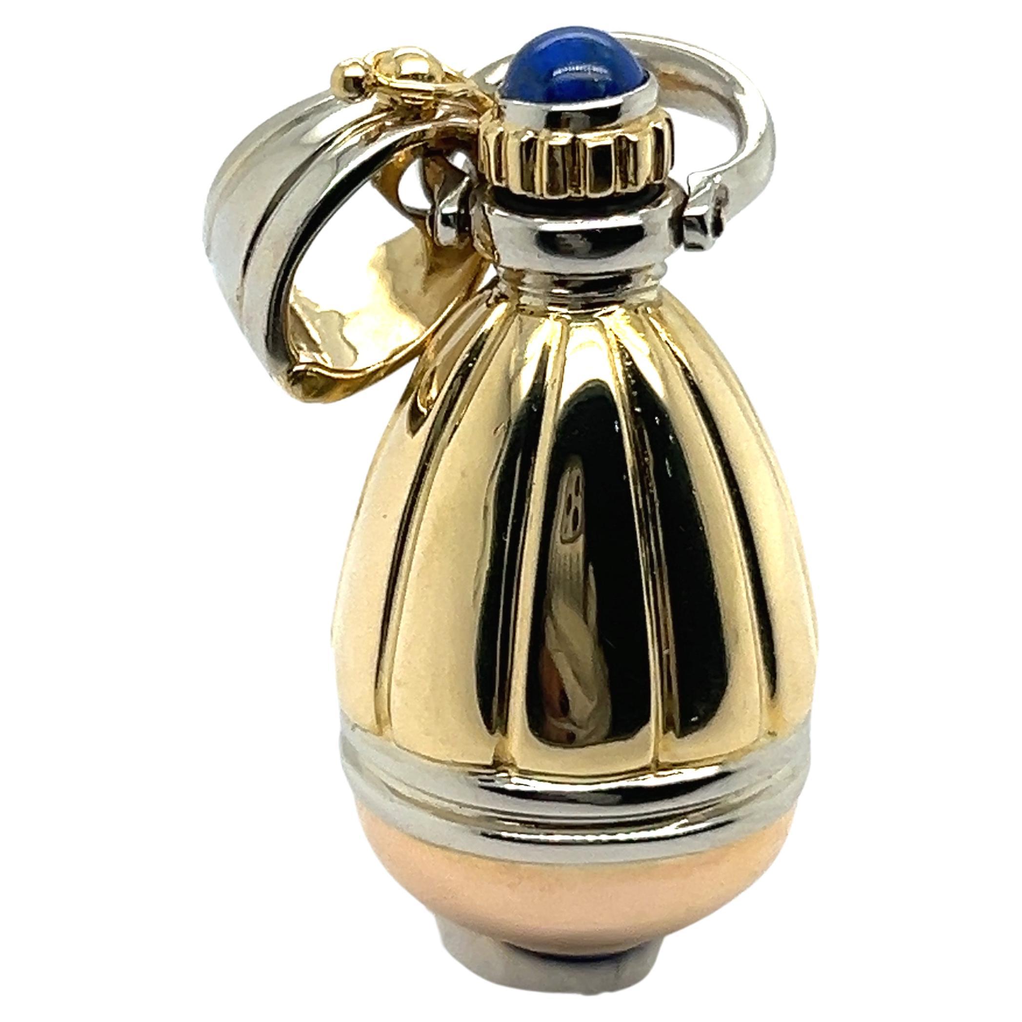 Introducing our exclusive perfume bottle, a harmonious blend of elegance and history. 

Crafted from 18 Karat yellow and white gold, it exudes sophistication and luxury. With two exquisite fantasy-cut lapis lazuli stones, this charming bottle tells