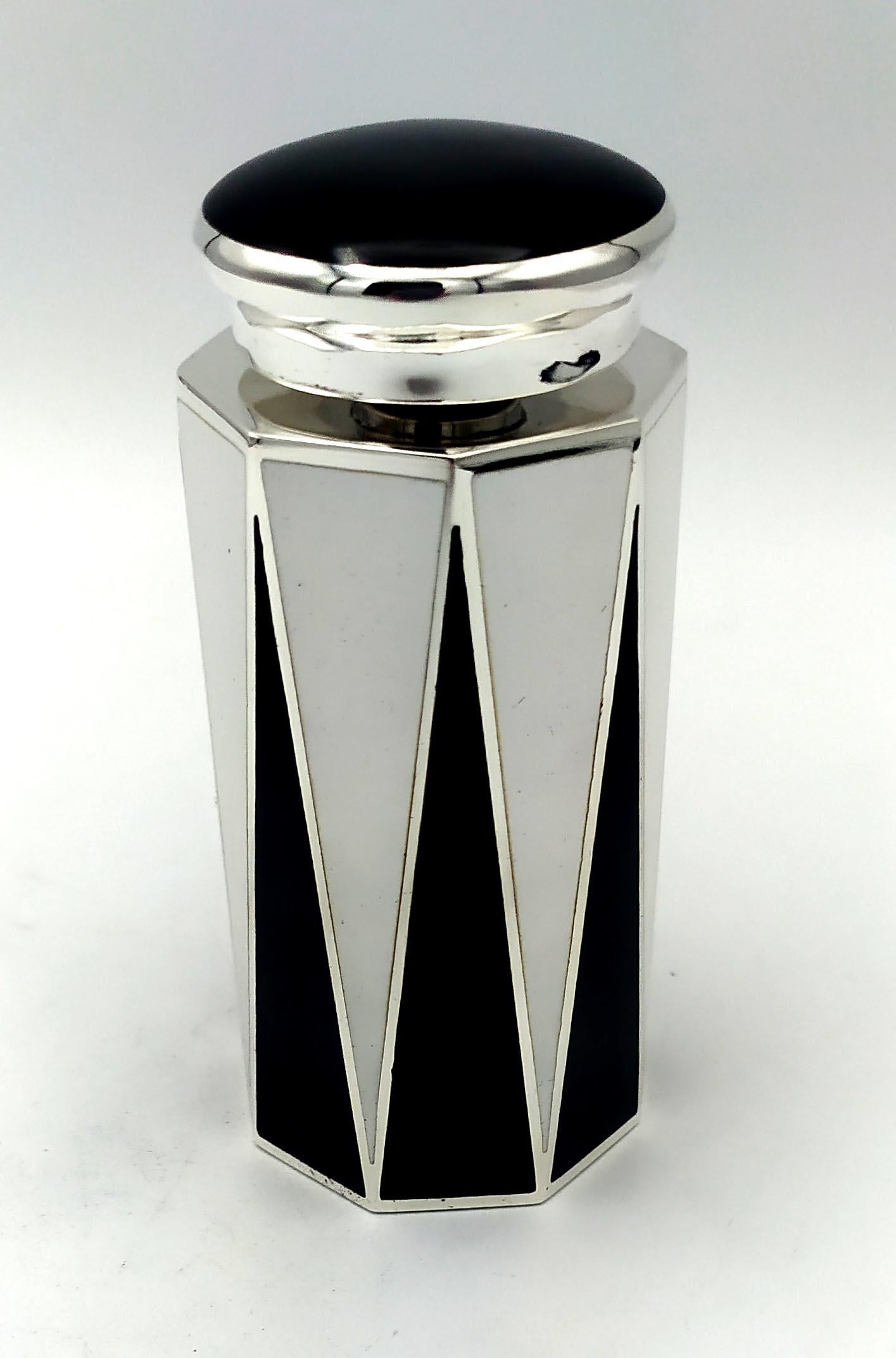 Perfume holder with octagonal base in black and white fired enamelled 925/1000 sterling silver with screw cap, in Art Deco style. Base cm, 4.3 x 4.7 bottle height cm. 8, total height cm. 10.7. Silver weight gr. 195. Designed by Giorgio Salimbeni in