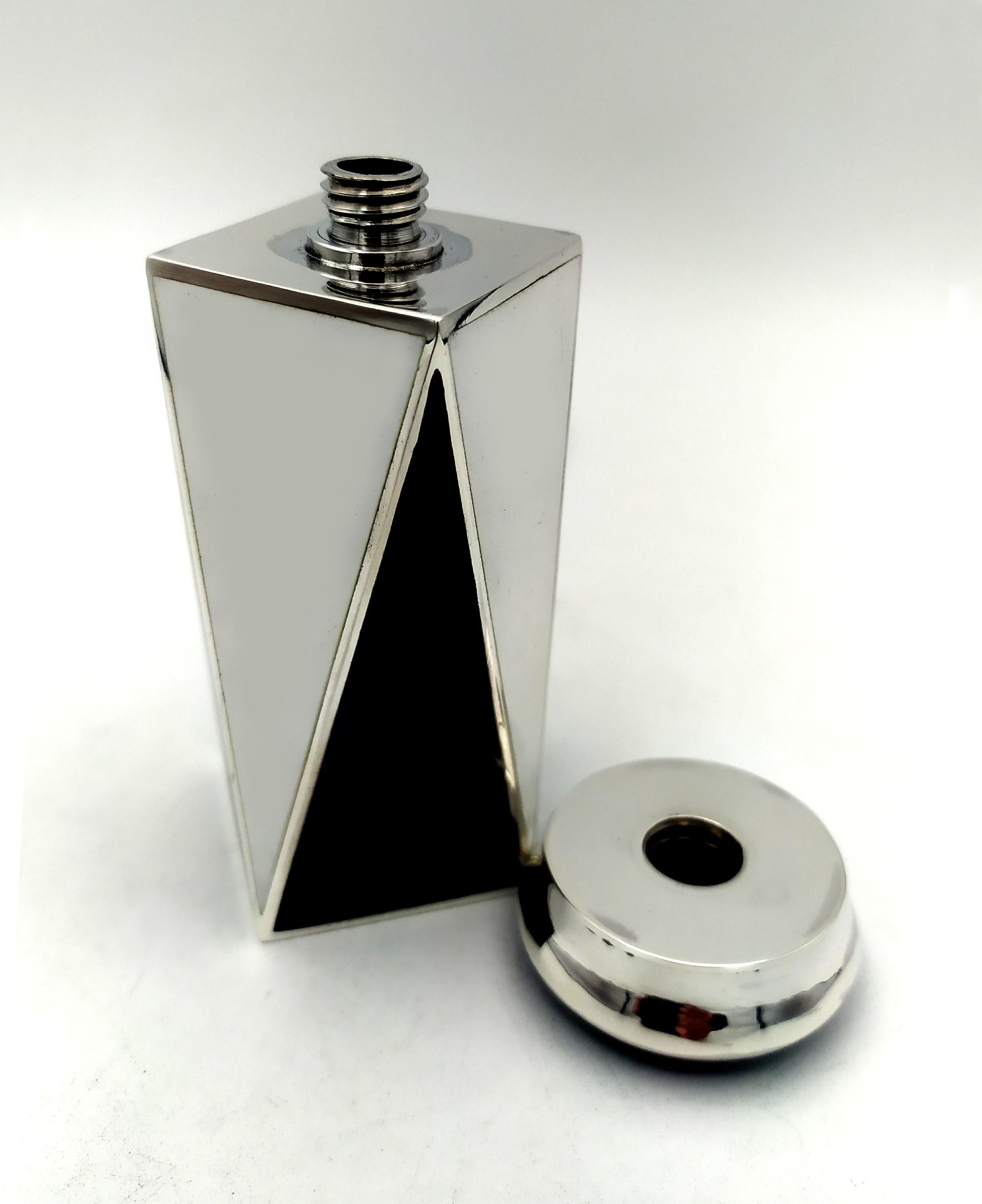 Square base perfume holder in black and white fired enamelled 925/1000 sterling silver with screw cap, in Art Deco style. Base cm, 3.6 x 3.6 bottle height cm. 8, total height cm. 10.7. Silver weight gr. 188. Designed by Giorgio Salimbeni in 1981 and