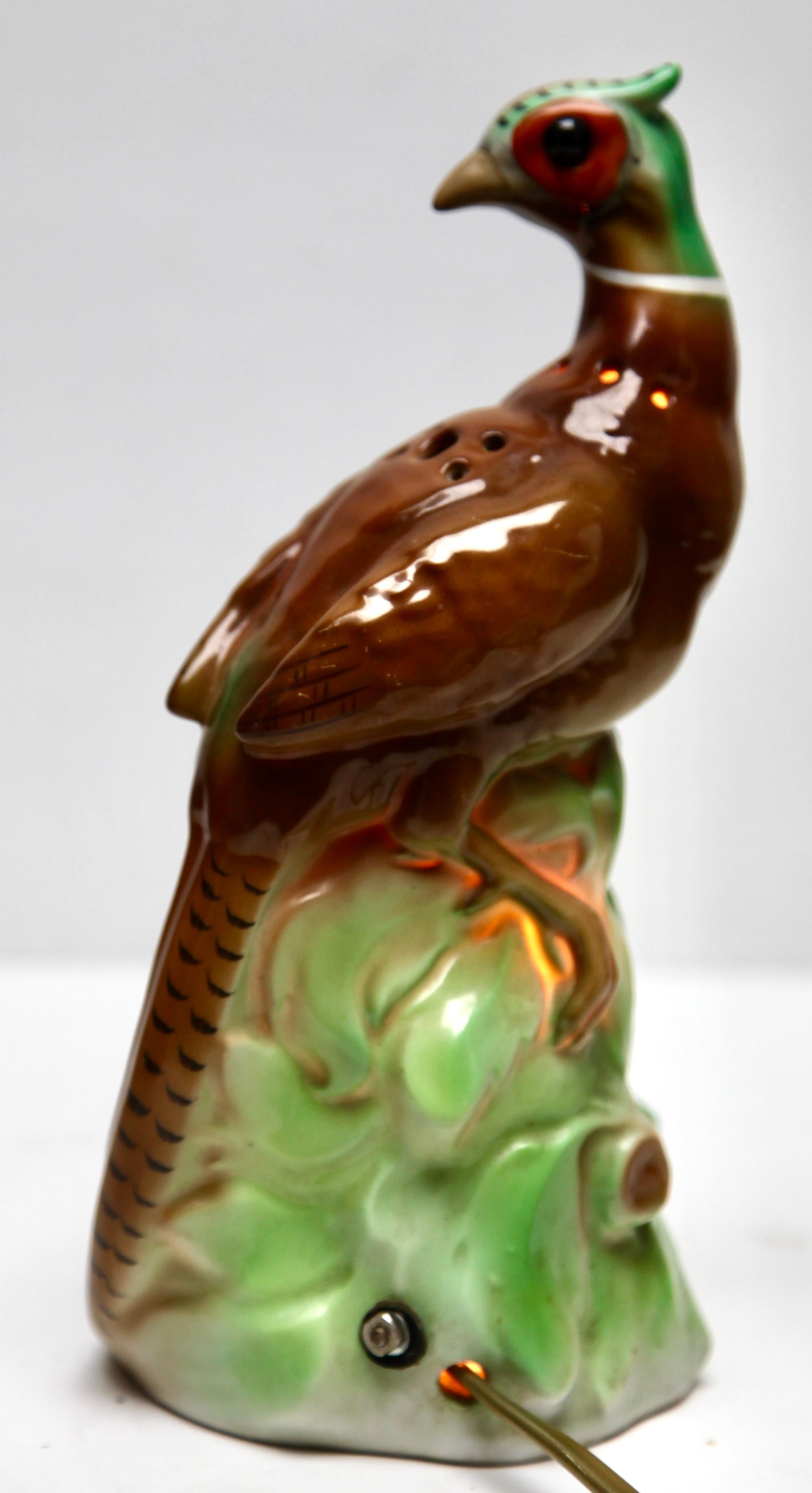 Perfume lamp in the form of a Bird attributed to Carl Scheidig Grafenthal, Germany. 
Made from glazed porcelain. 
Electrical parts European standards with an inner light bulb (standard E 14) to give a warm and comforting night light. The light