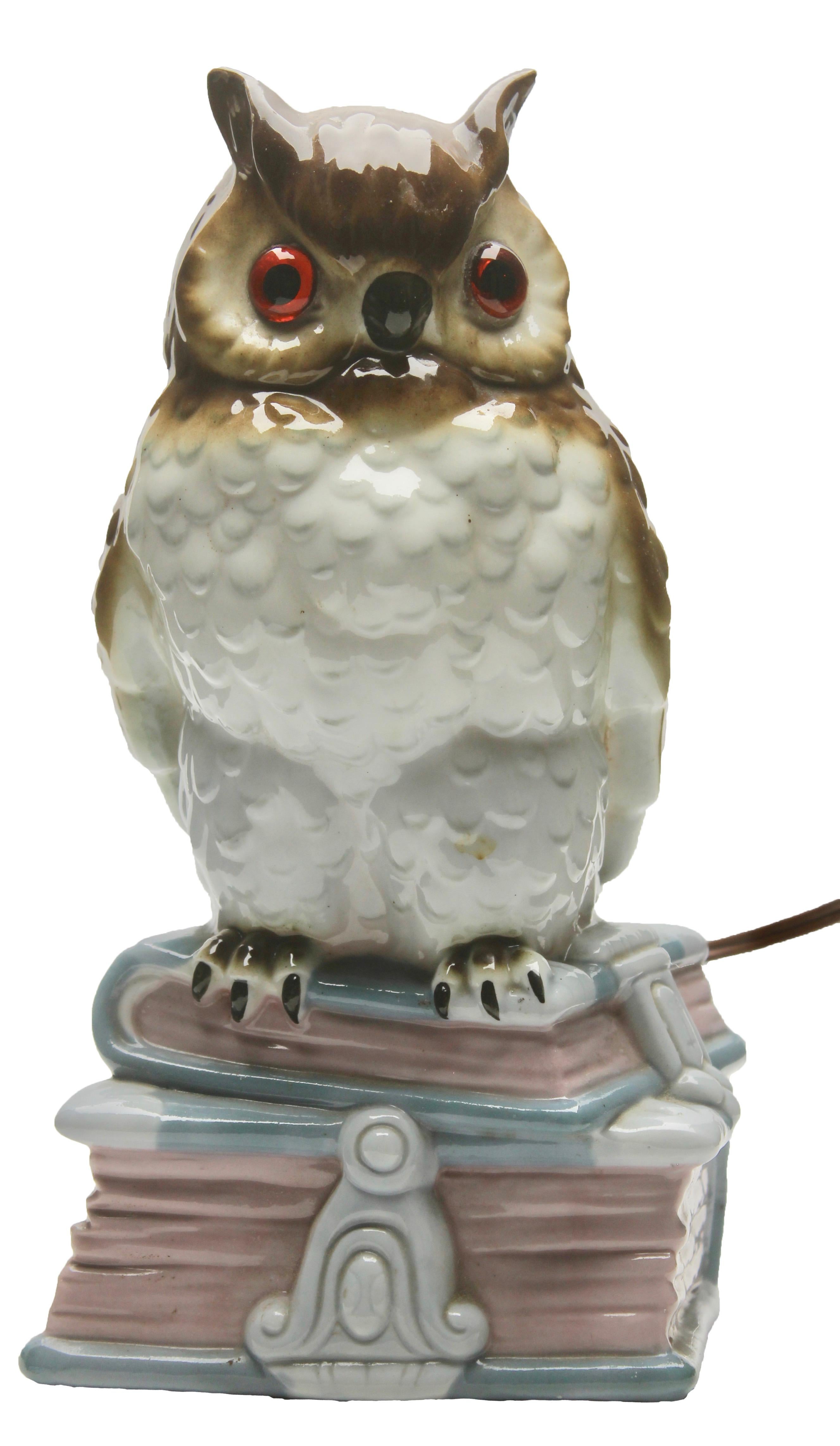 Perfume lamp in the form of an owl attributed to Carl Scheidig Grafenthal, Germany. 
Made from glazed porcelain. 
Electrical parts European standards with an inner light bulb (standard E 14) to give a warm and comforting night light. The light