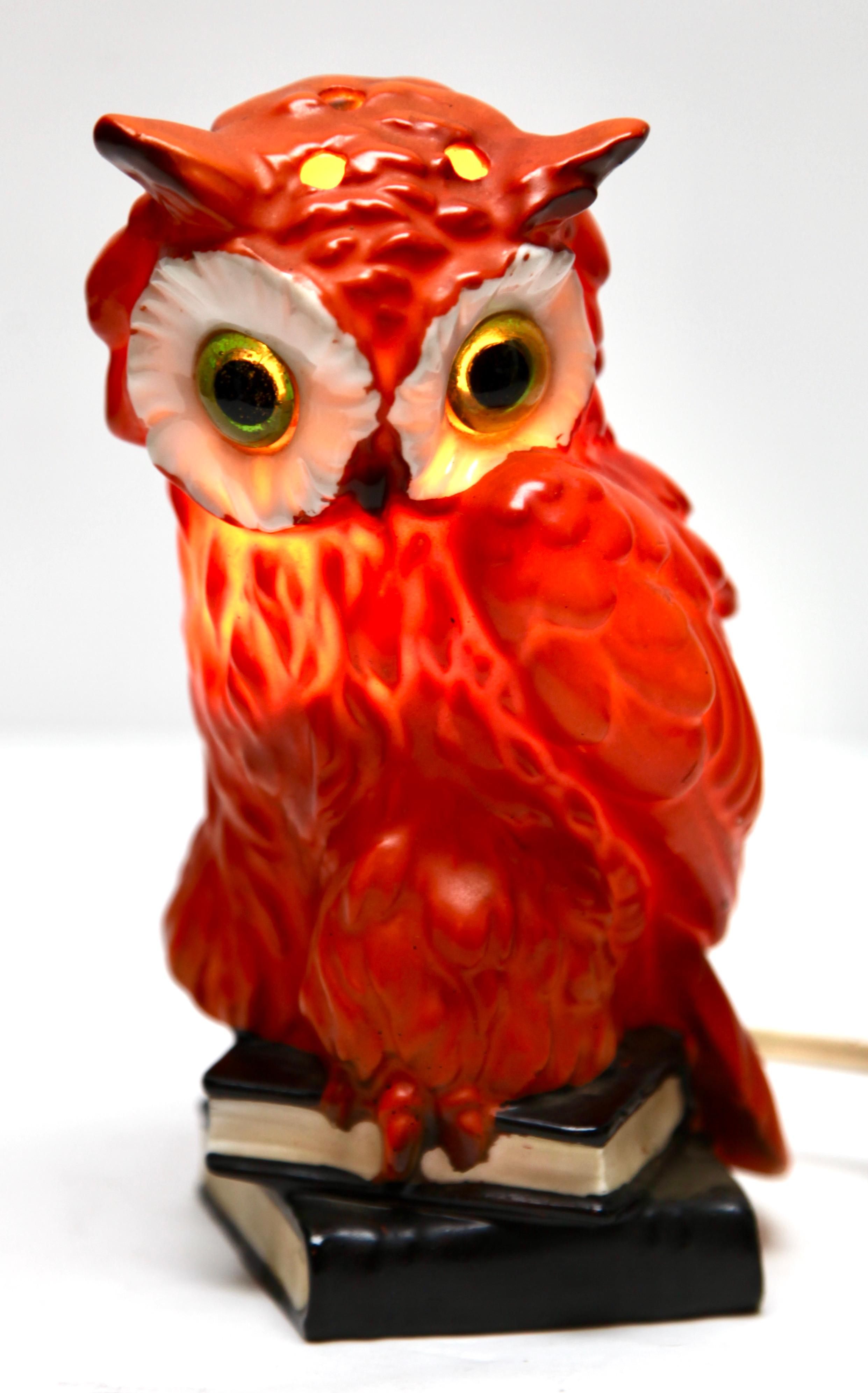 Perfume lamp in the form of an owl attributed to Carl Scheidig Grafenthal, Germany. 
Made from glazed porcelain. 
Electrical parts European standards with an inner light bulb (standard E 14) to give a warm and comforting night light. The light
