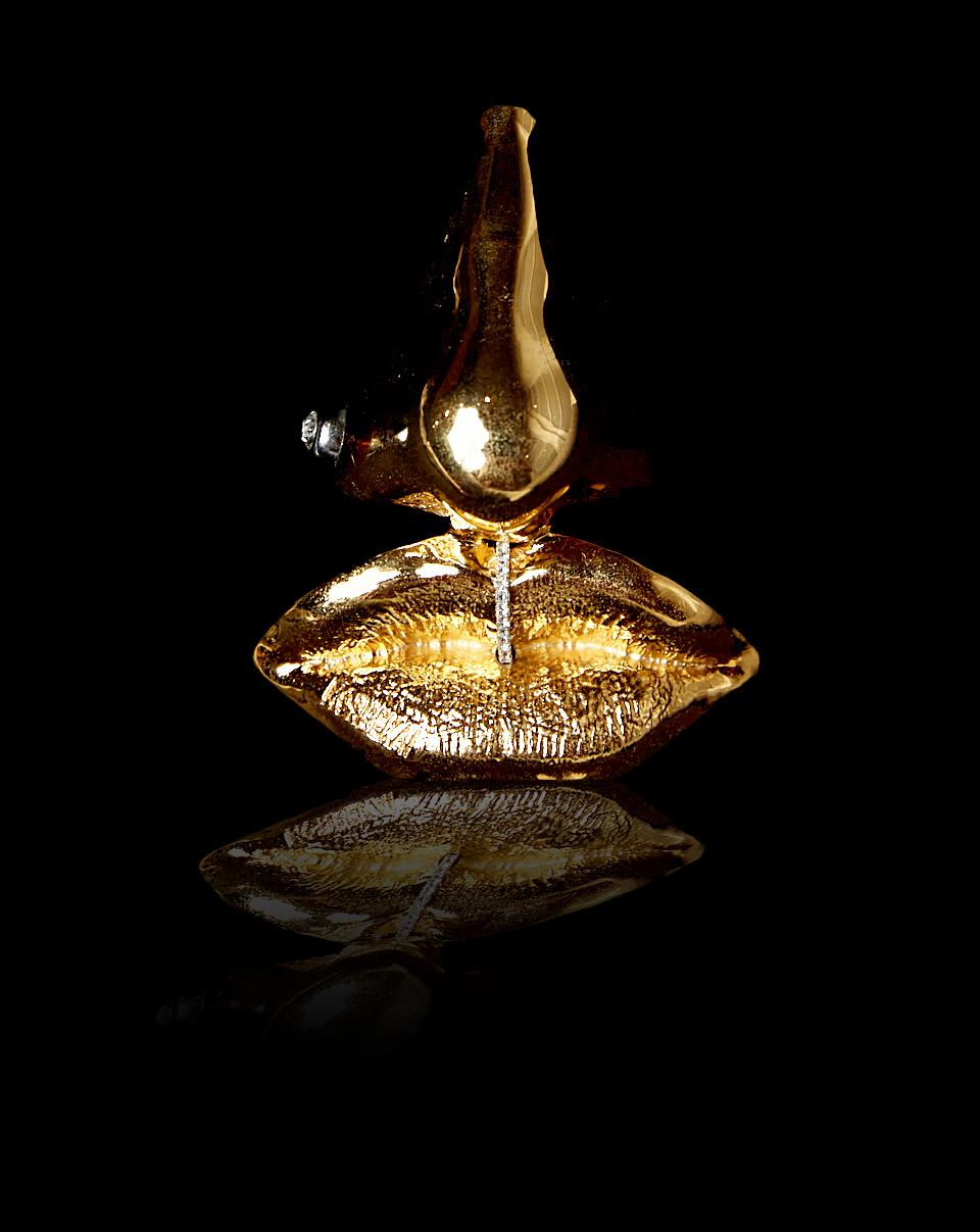 Inspired by the Dali perfume bottle, this pendant is the most unique conversation and statement neckpiece you will ever own. Produced through a painstaking process of 3D printing and handmade casting, this mini sculpture is the centerpiece of the