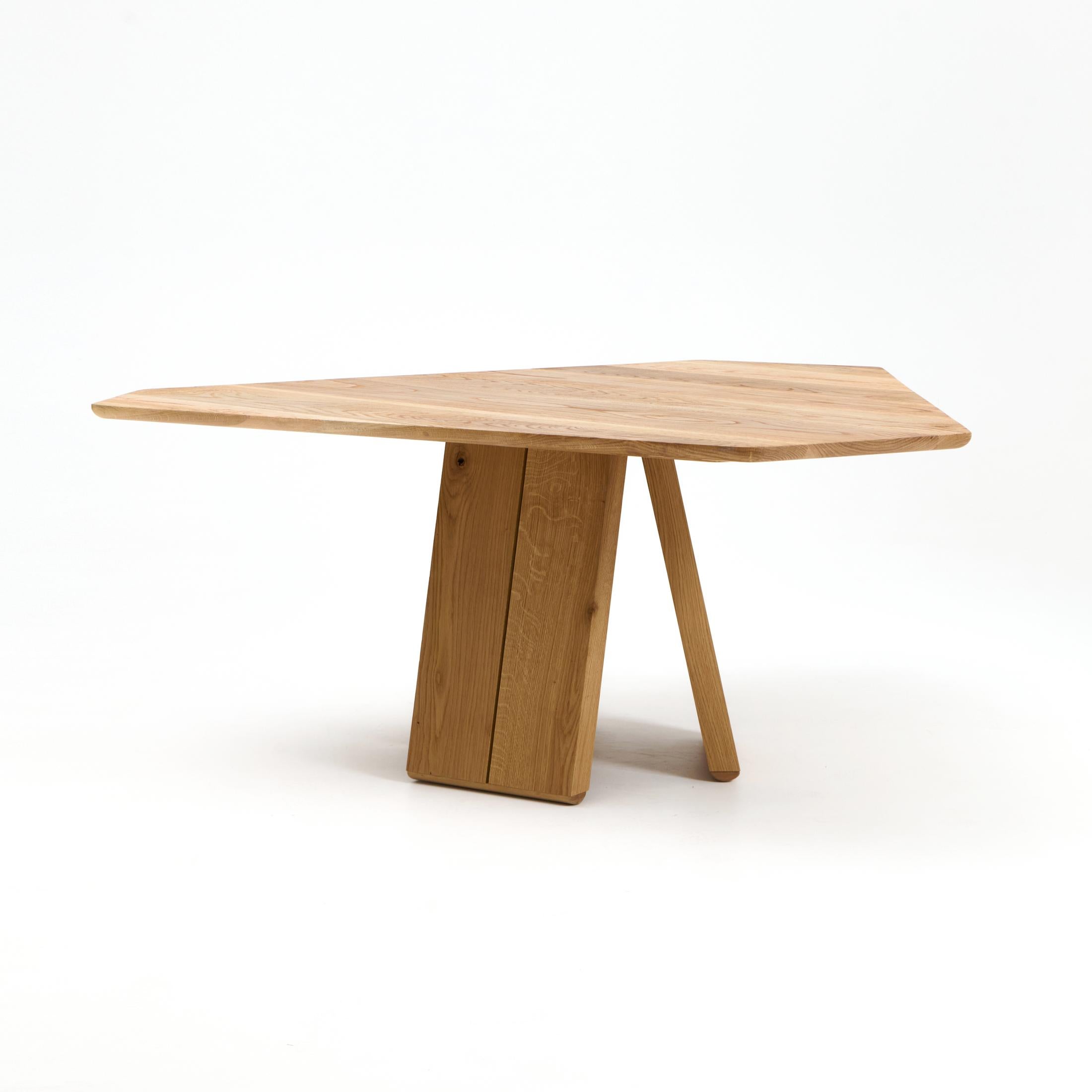 PERICIA DINIG TABLE, designed in 2025.

This dining table has an asymmetric triangular table top with rounded edges. Available in custom dimensions. To view our other wood options please contact us.

Made to Order
Production lead time: 8-12