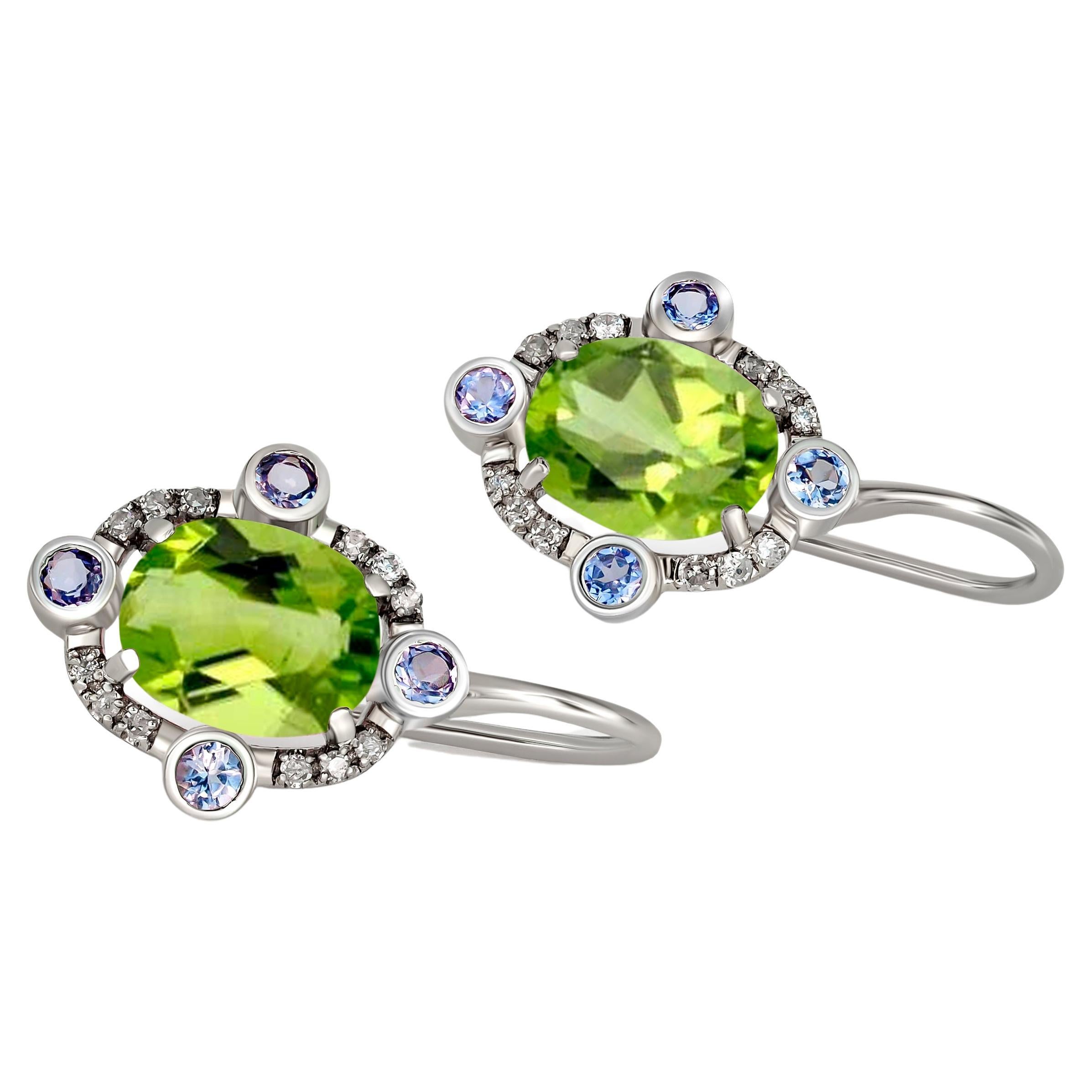 Peridot 14k gold drop earrings.