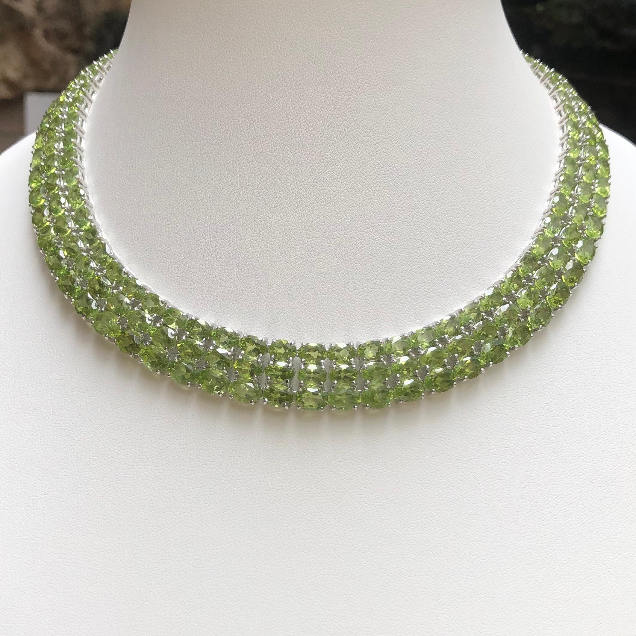 Peridot 175.10 carats Necklace set in Silver Settings

Width:  1.6 cm 
Length: 46.0 cm
Total Weight: 103.98 grams

*Please note that the silver setting is plated with gold to promote shine and help prevent oxidation.  However, with the nature of